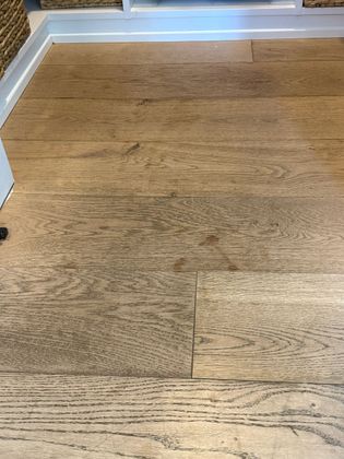 A close up of a wooden floor in a room