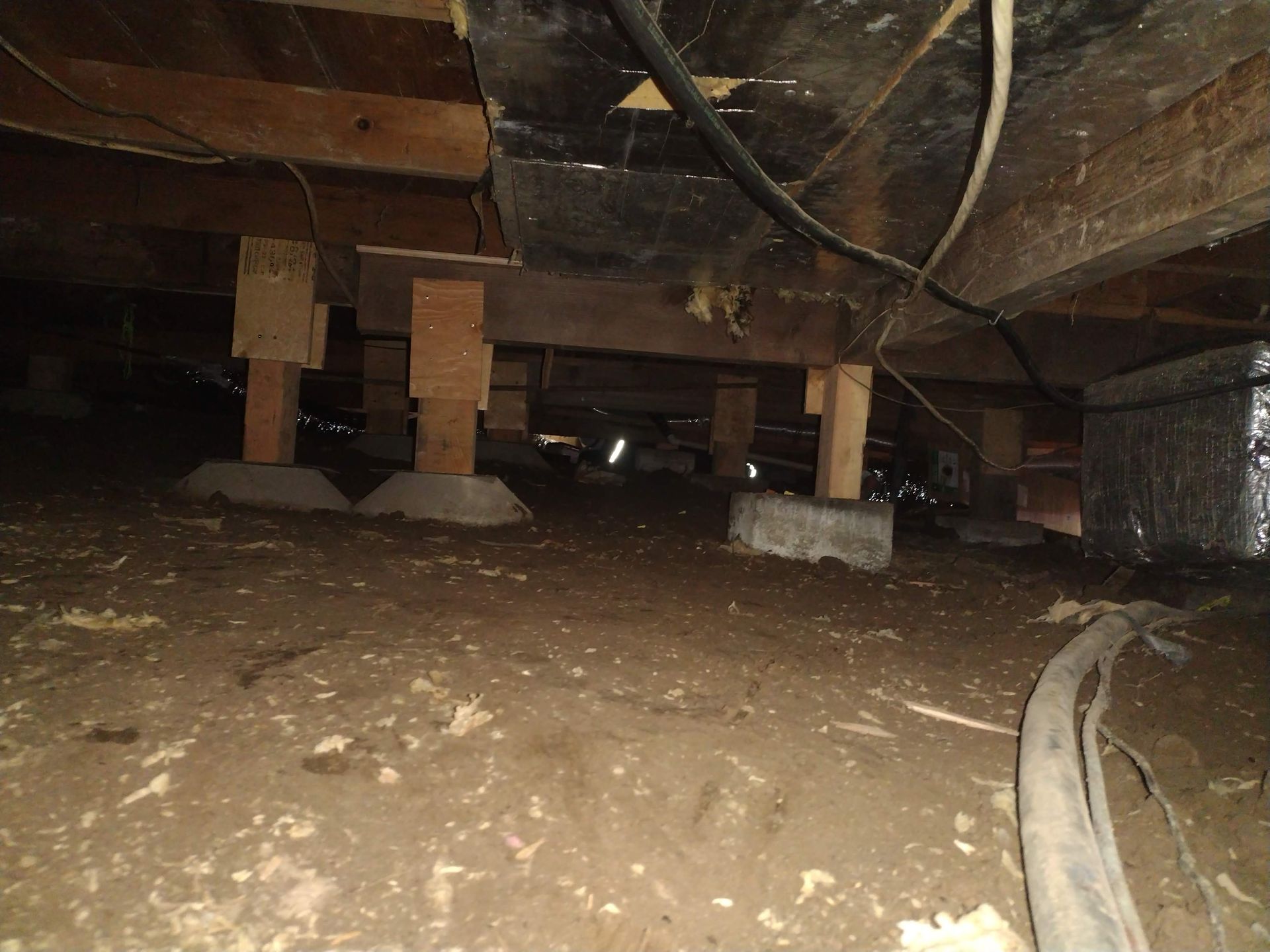 A concrete foundation is being built on a construction site.