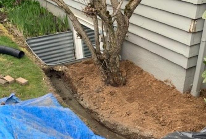 A concrete foundation is being built on a construction site.