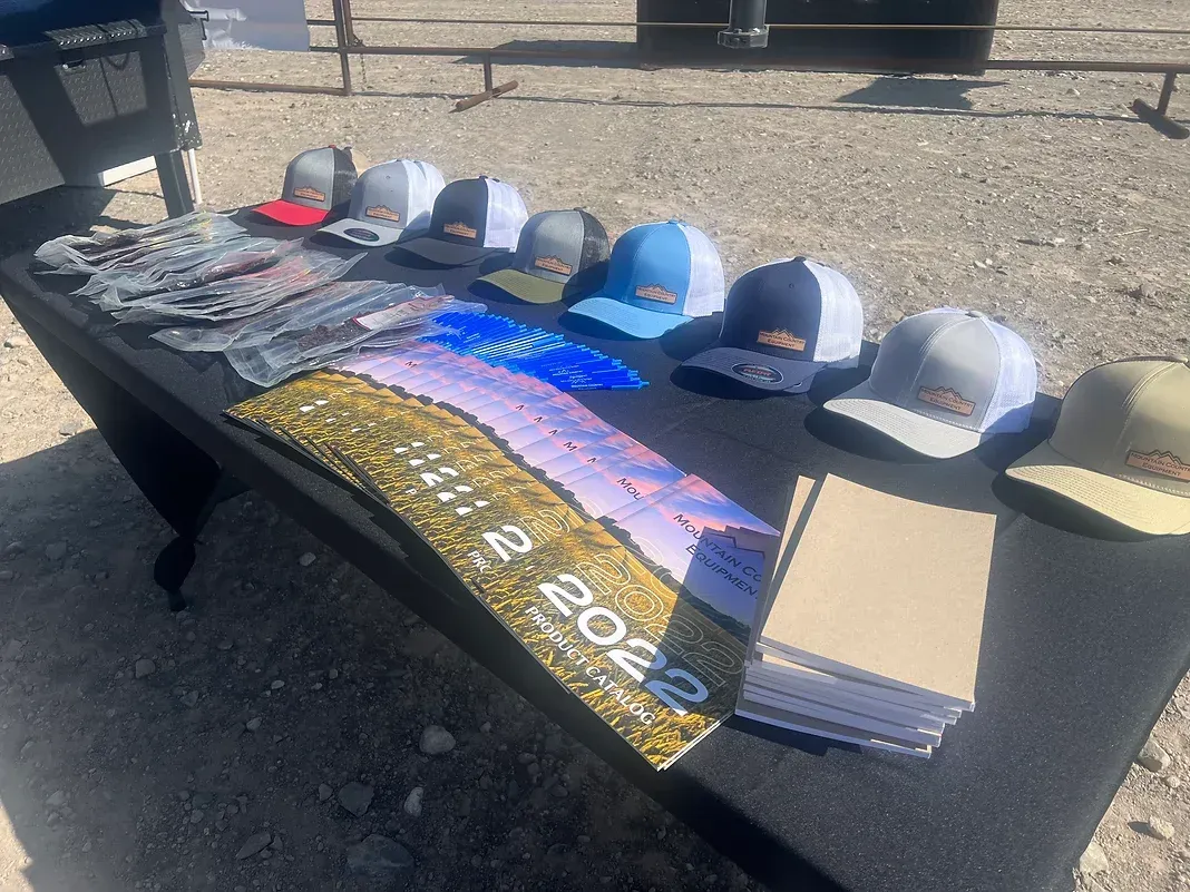 A table with a bunch of hats on it