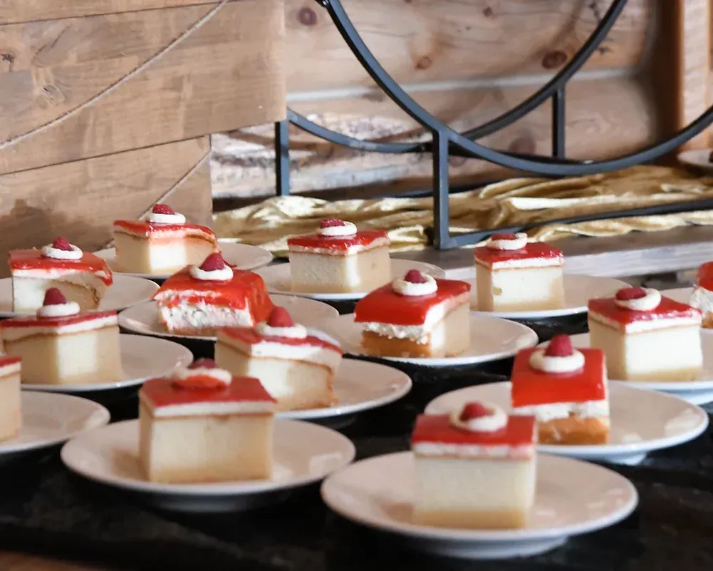 A bunch of desserts on plates on a table
