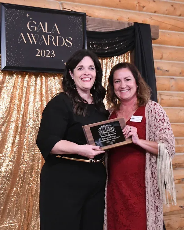 Two women are standing next to each other in front of a sign that says gala awards 2023.