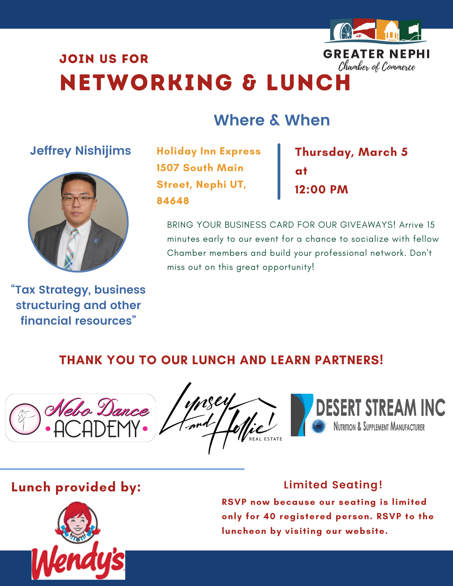 A man in a suit and plaid shirt is smiling for the camera.