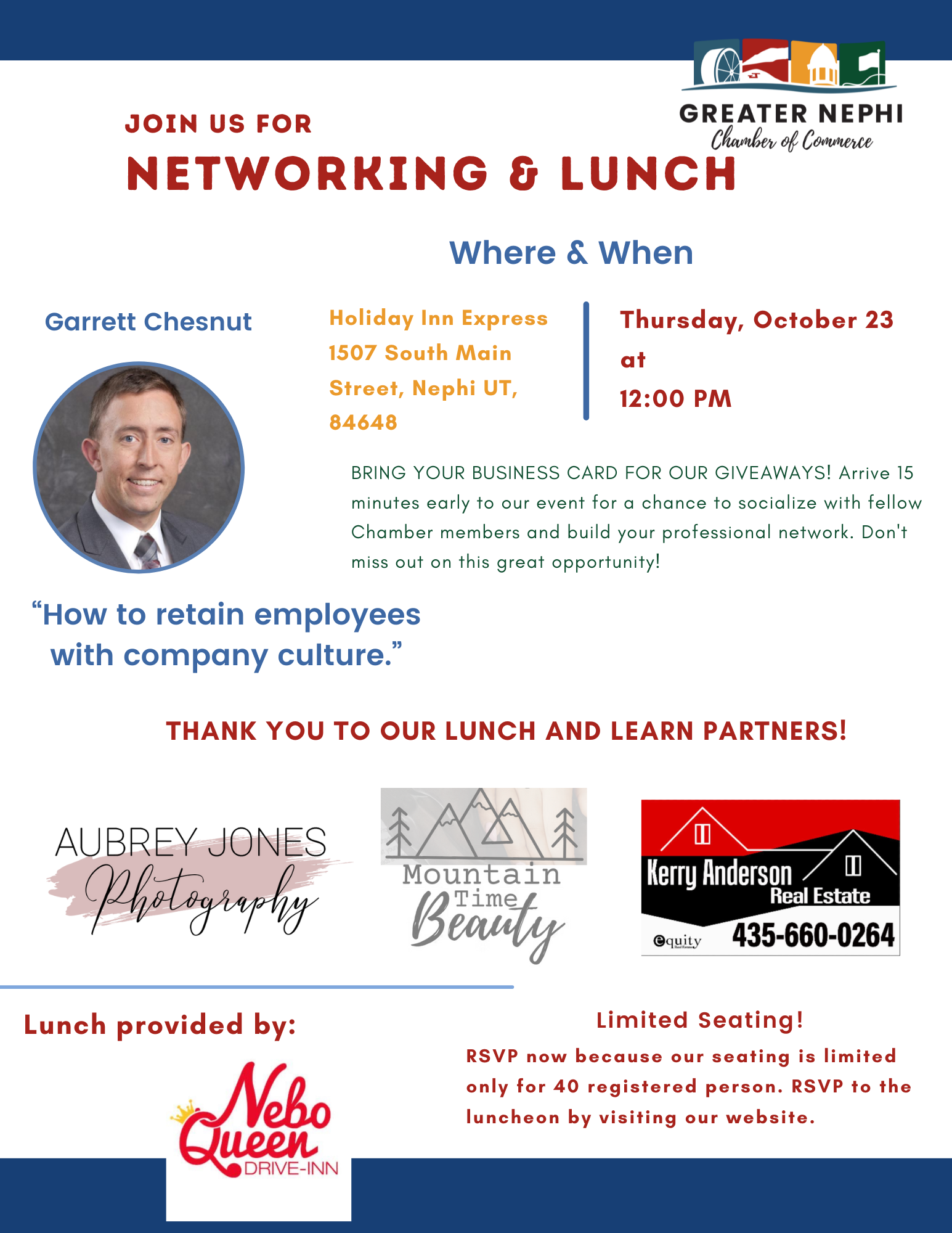 A man in a suit and plaid shirt is smiling for the camera.