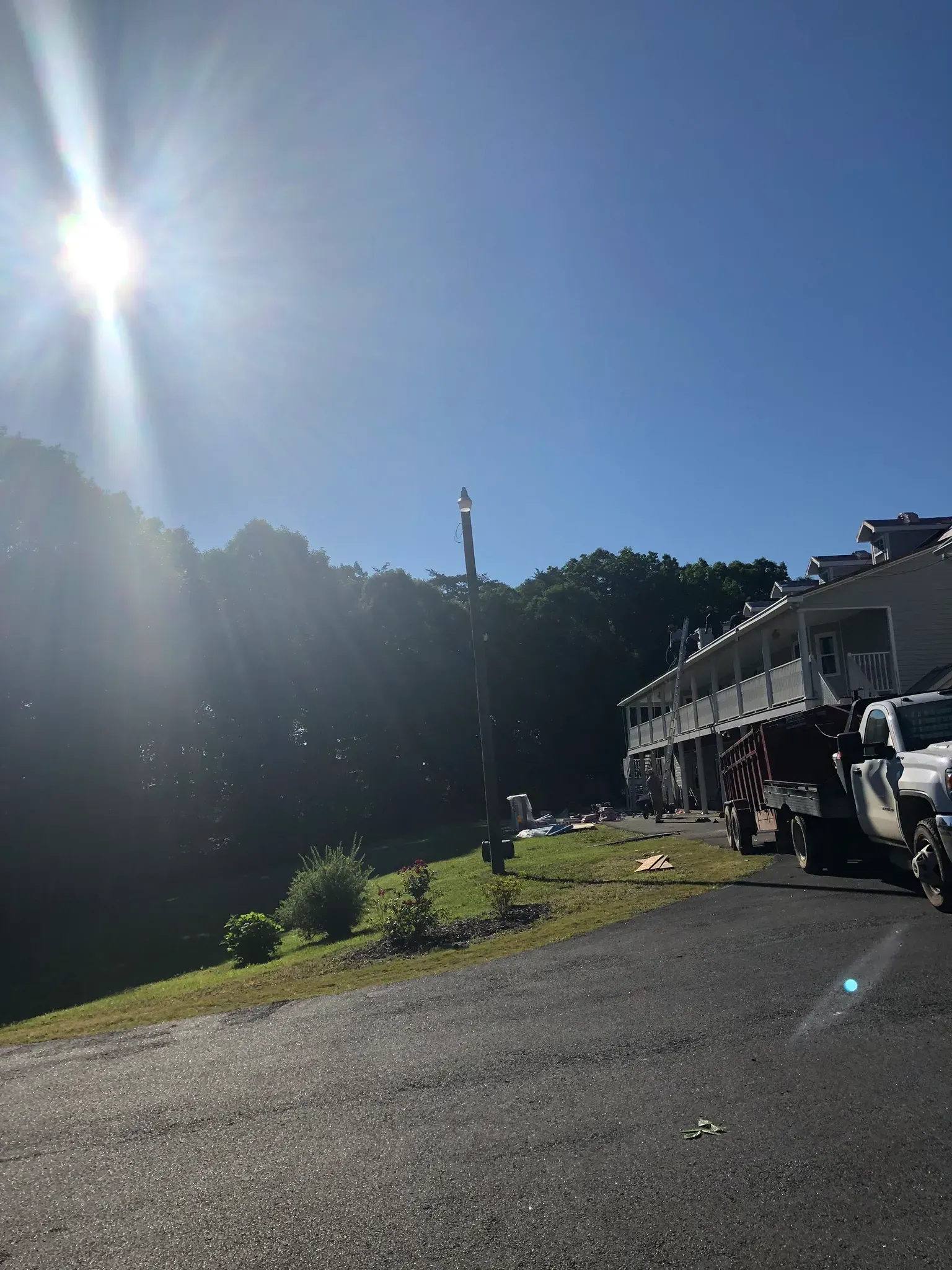 A tow truck is parked on the side of the road in front of a building.