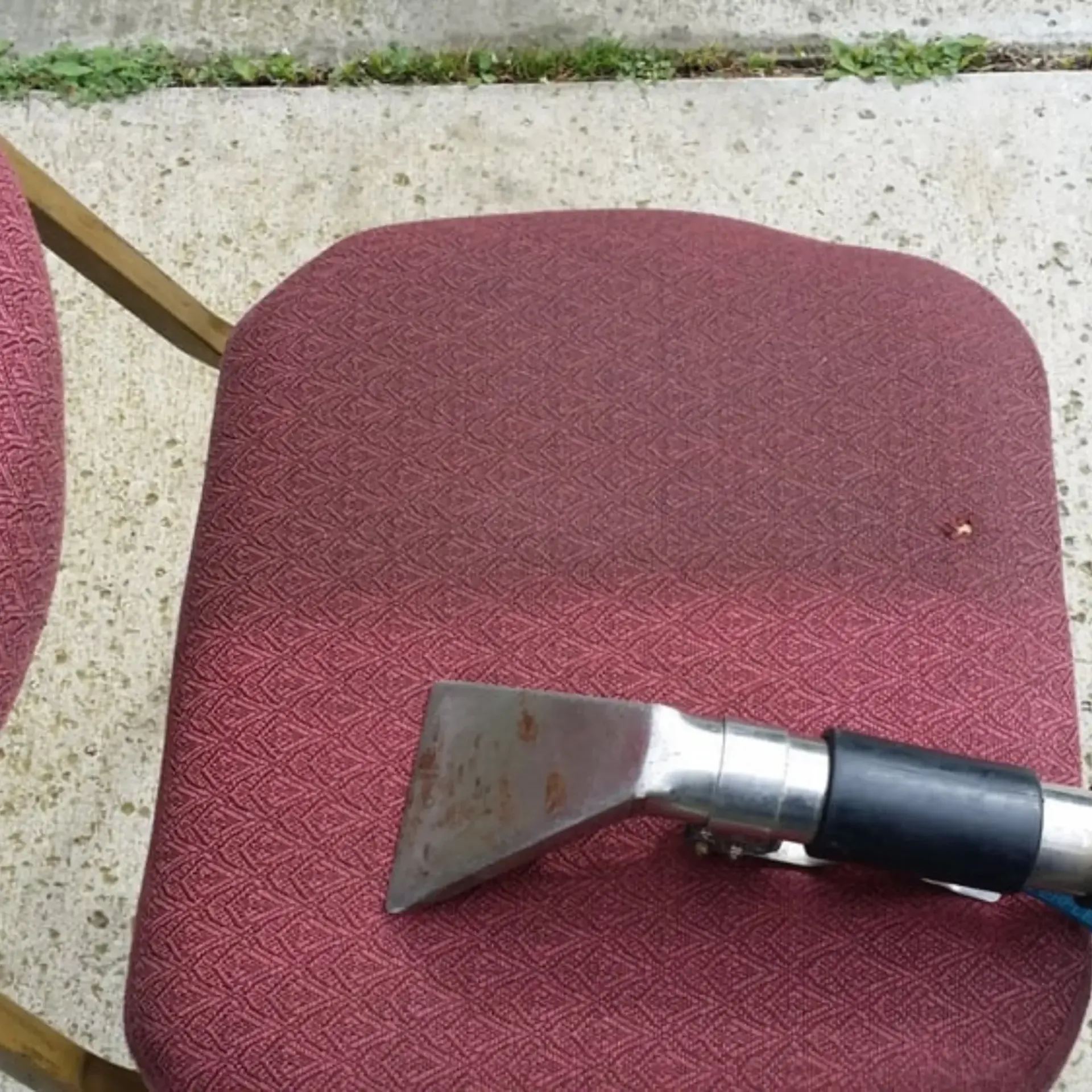 Powerhouse Carpetcleaning -
A chair is being cleaned with a vacuum cleaner