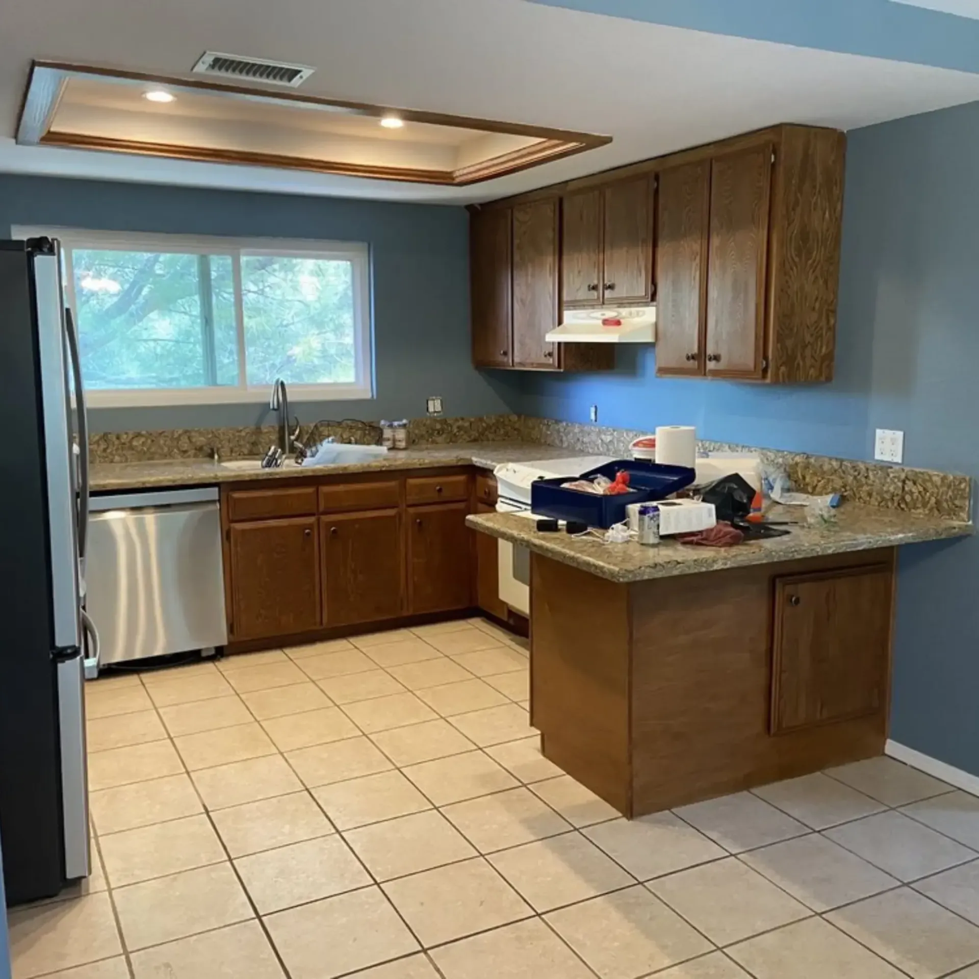 Powerhouse Carpetcleaning - A kitchen with stainless steel appliances and wooden cabinets