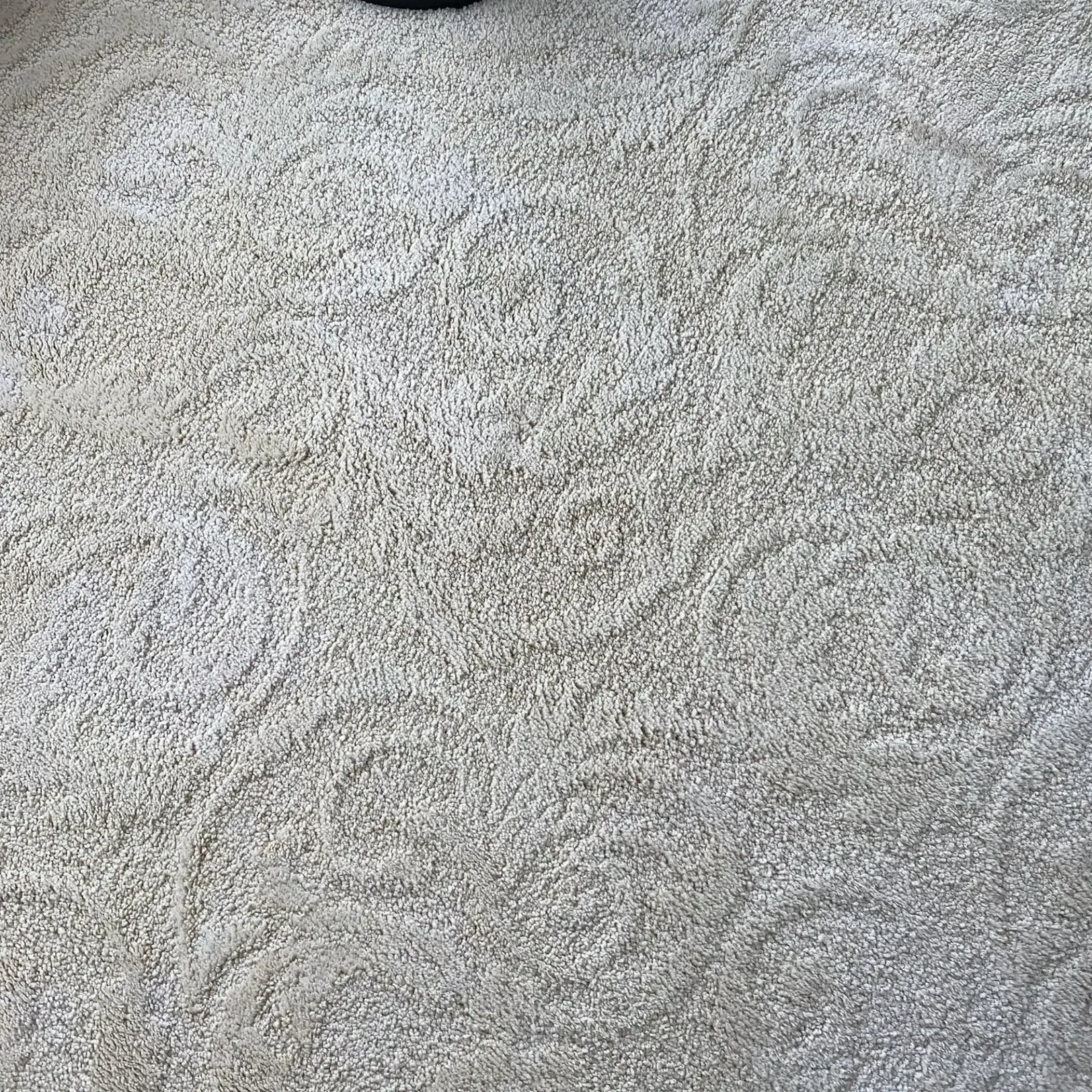 Powerhouse Carpetcleaning -  A close up of a white carpet with a pattern on it.