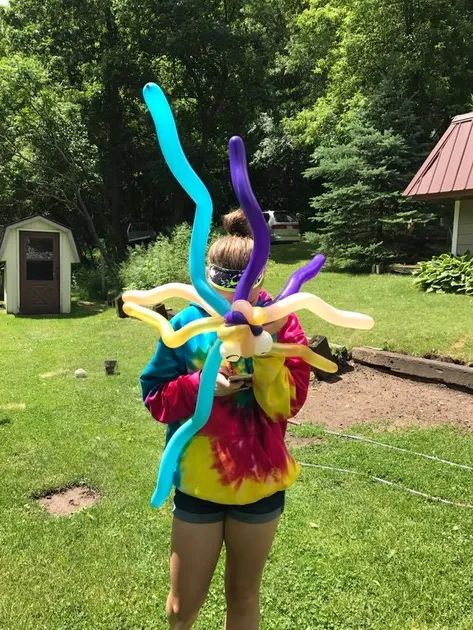 Woman Holding a Balloons — Wilton, WI — Tunnel Trail Campground