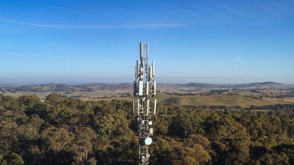 An Aerial View Of A Cell Phone Tower In The Middle Of A Forest — Bradshaws Radio & TV Service In Hervey Bay, QLD