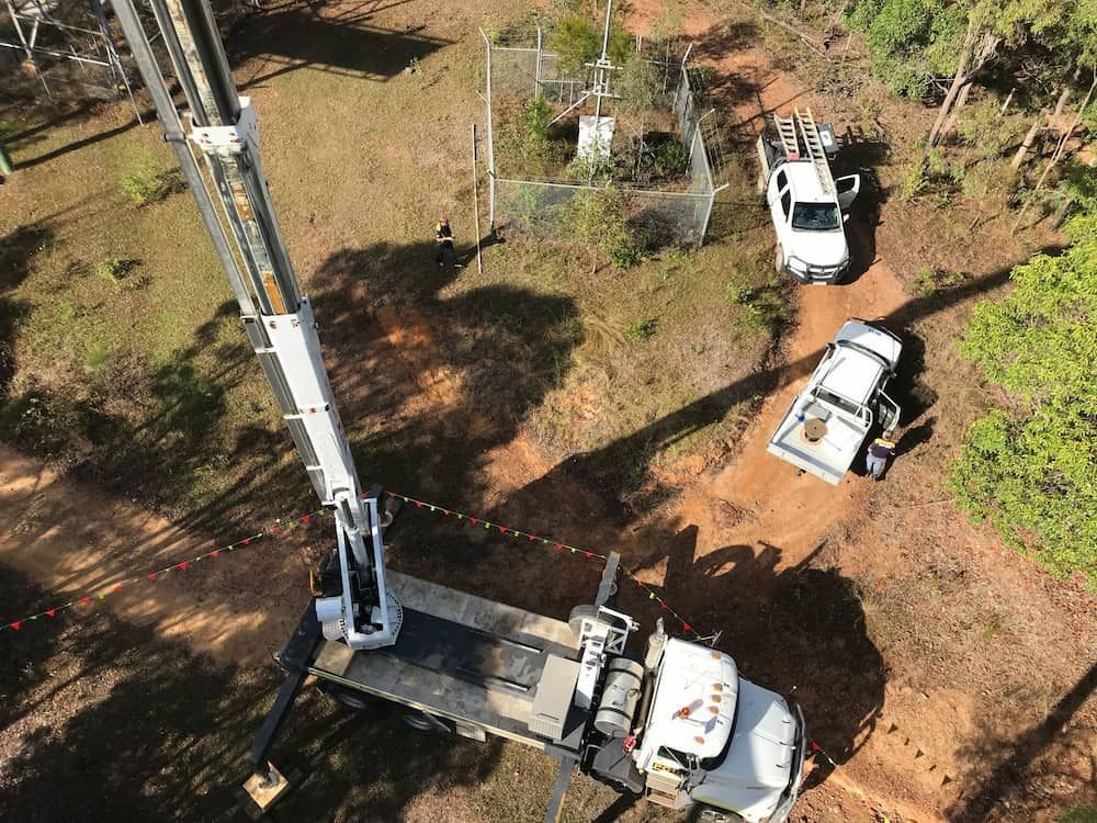 An Aerial View Of Three Trucks Parked On A Dirt Road— Bradshaws Radio & TV Service In Maryborough, QLD 