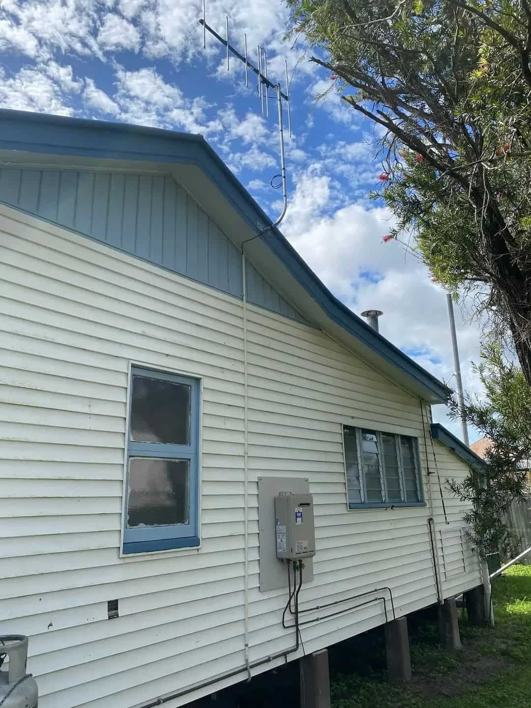 A White House With A Blue Roof And A Blue Window — Bradshaws Radio & TV Service In Maryborough, QLD