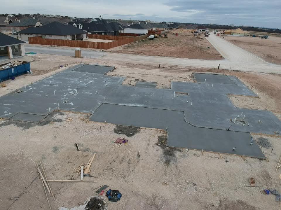 Concrete foundation walls with metal rods, newly constructed, outdoor.