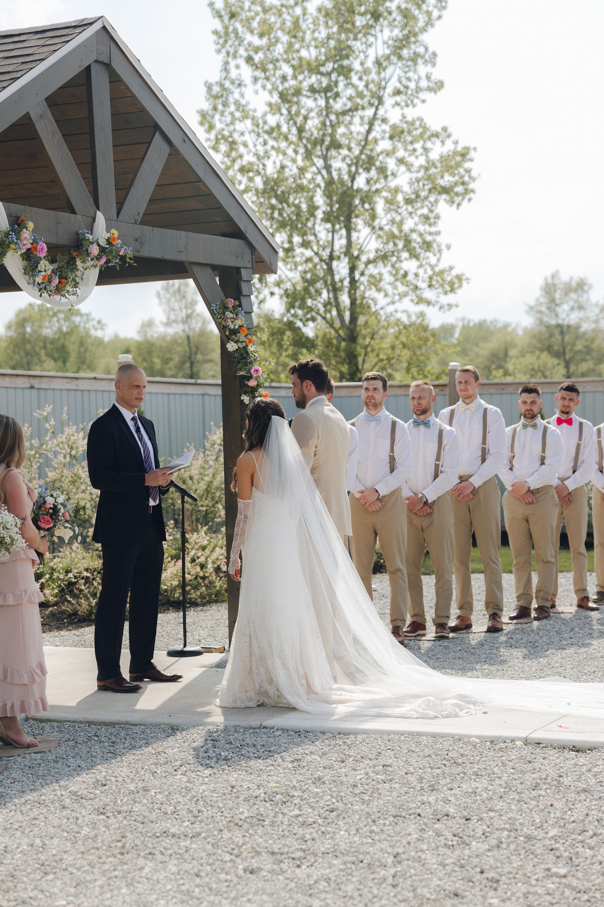 A bride and groom are standing at the altar at their wedding ceremony.