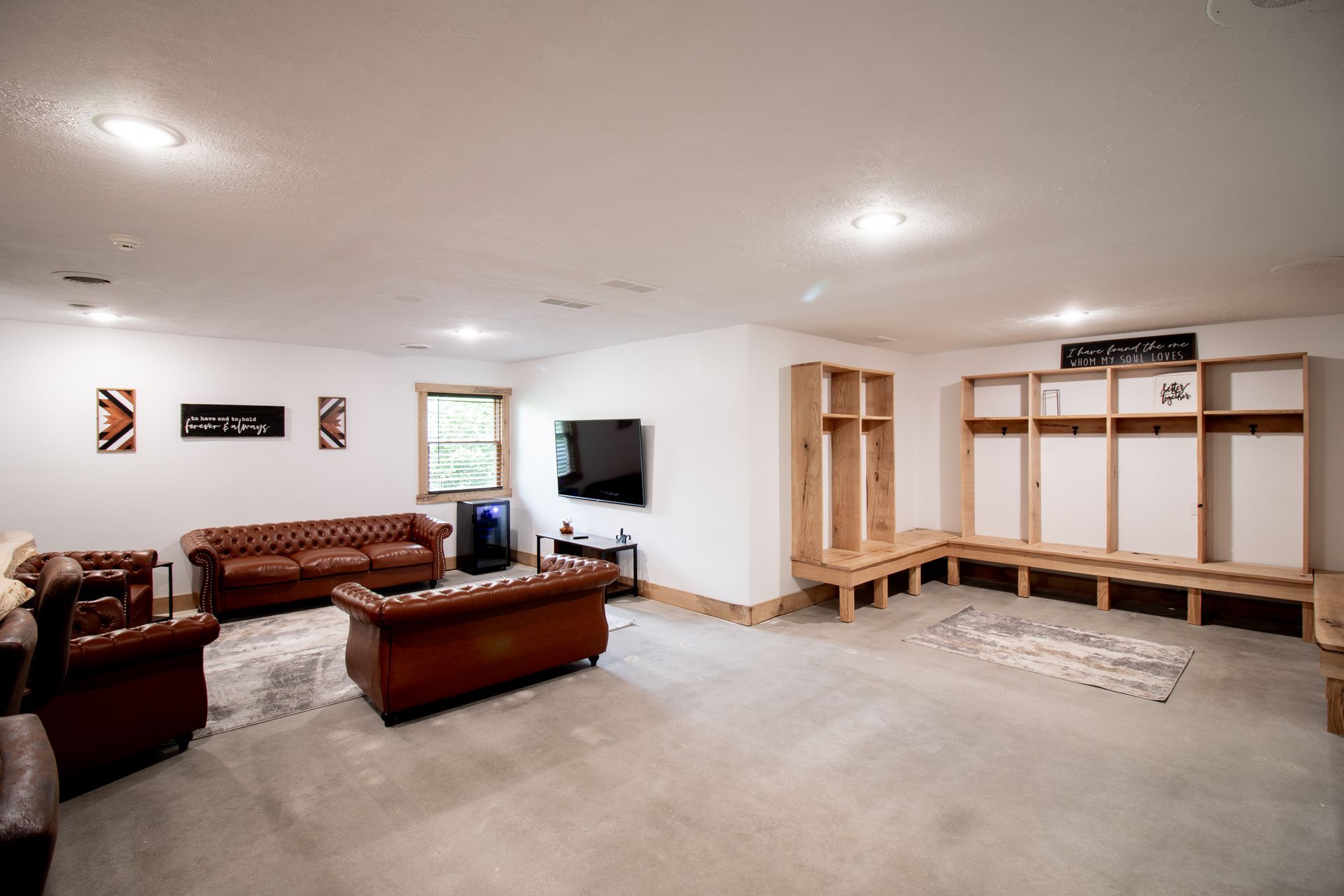 A living room with a couch and chairs in it