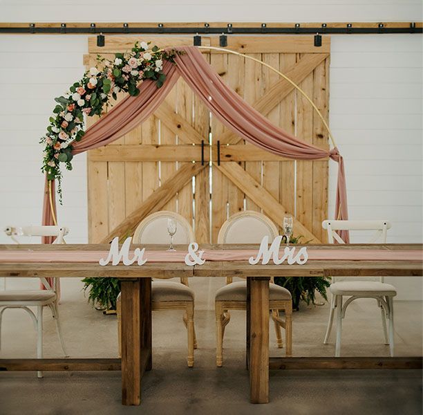 A wooden table with mr. and mrs. written on it