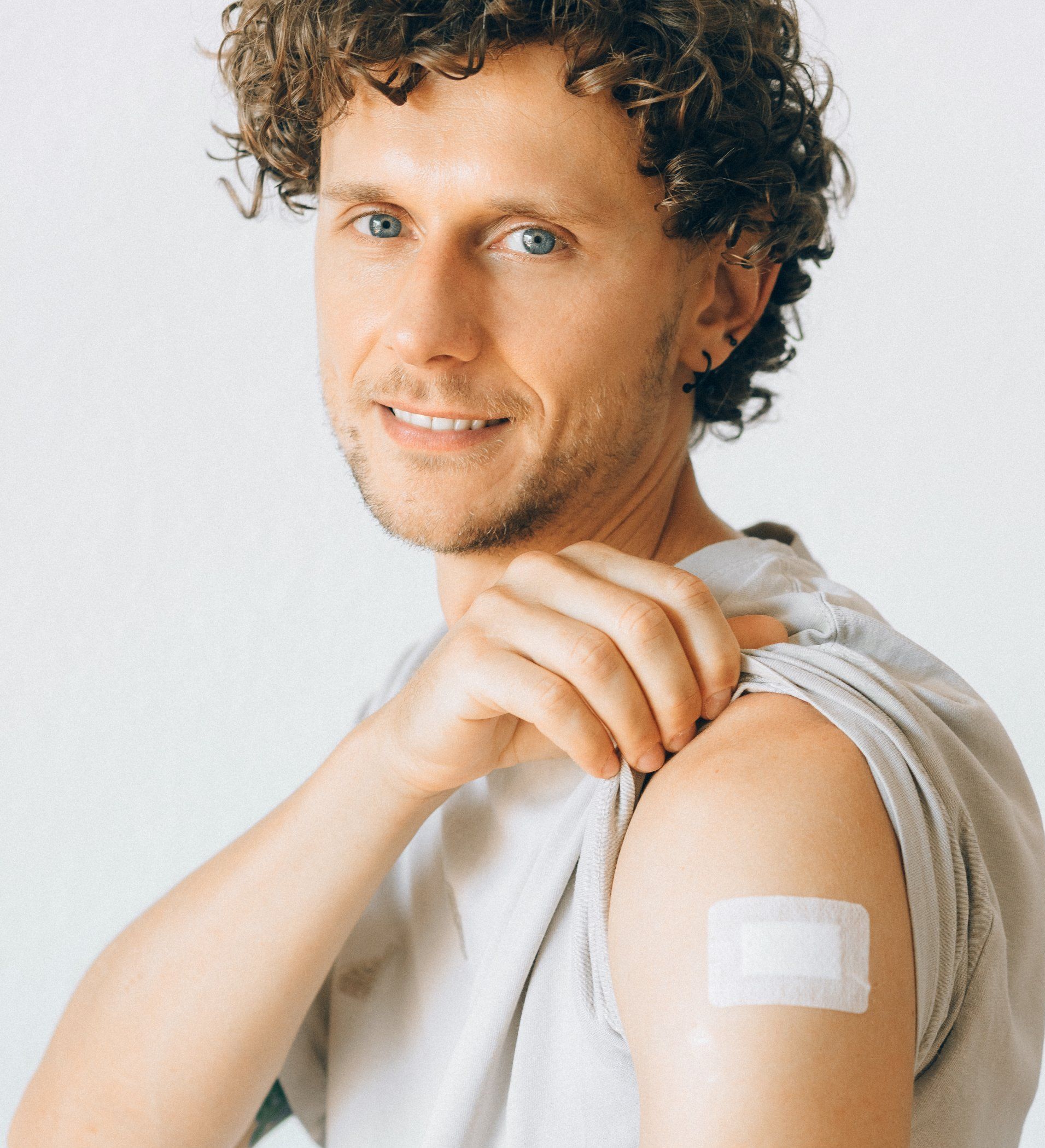 Man with uncovered arm ready for vaccination