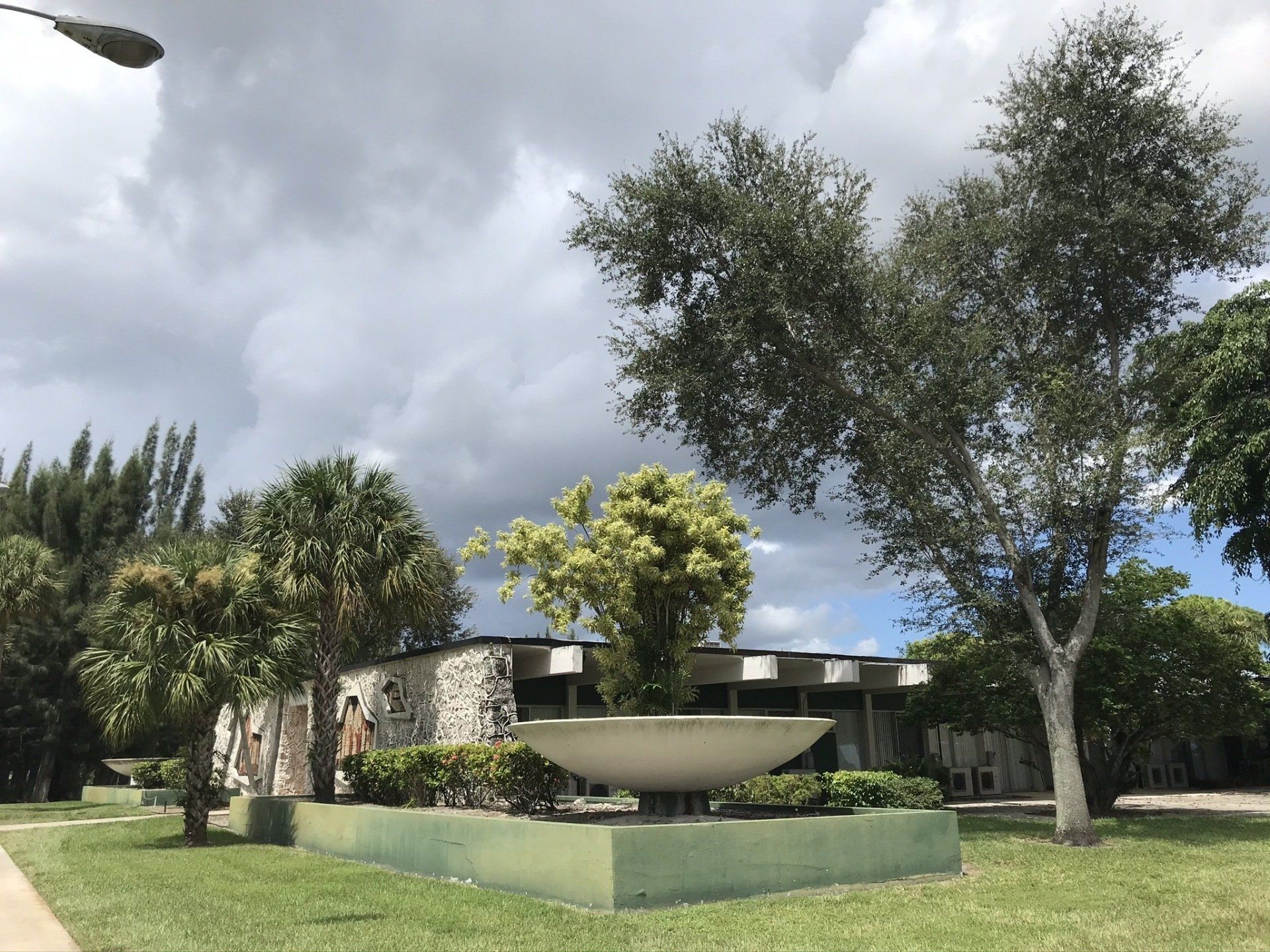 A house with a large planter in front of it