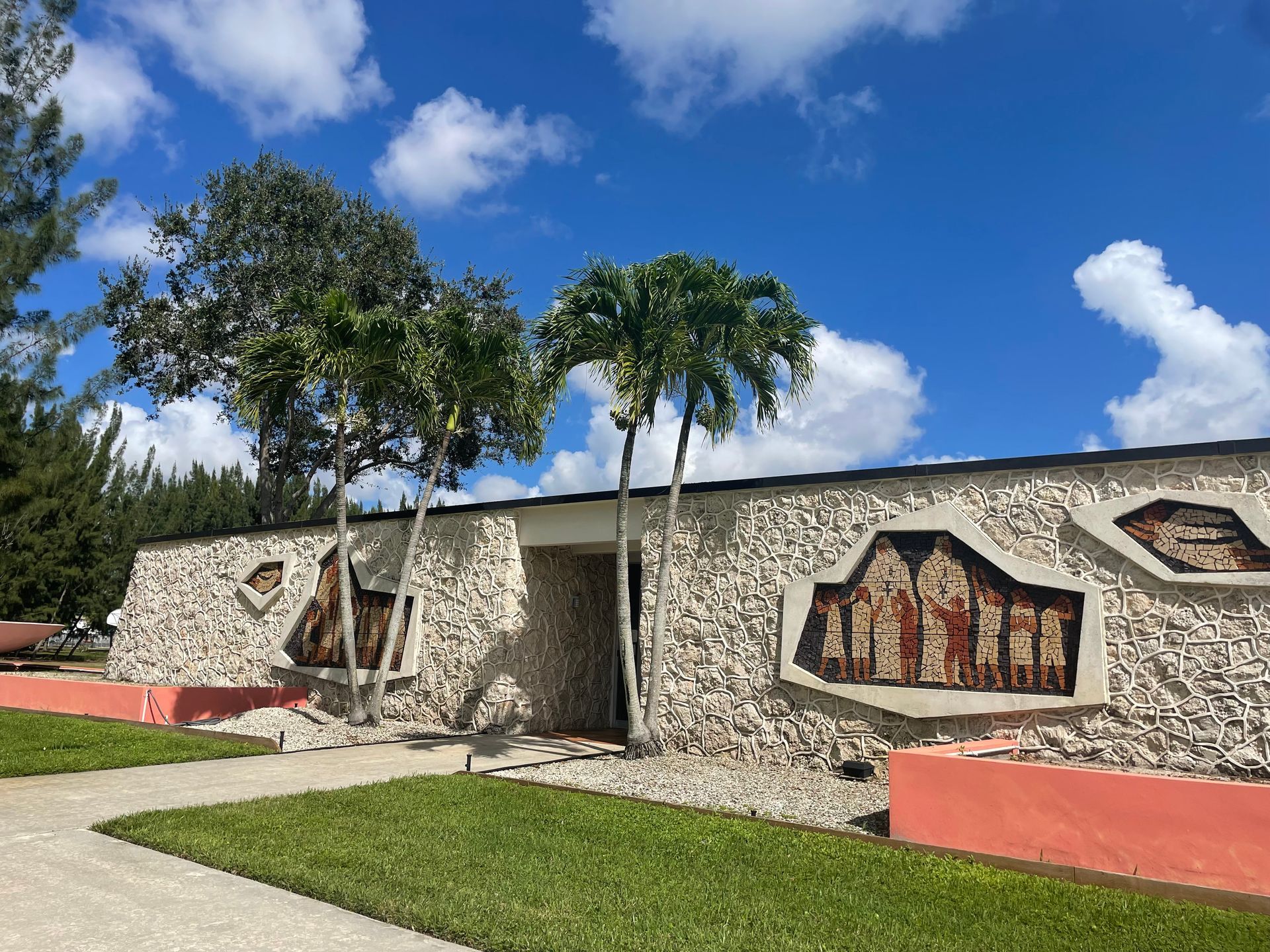 A large bowl with a tree in it in front of a house