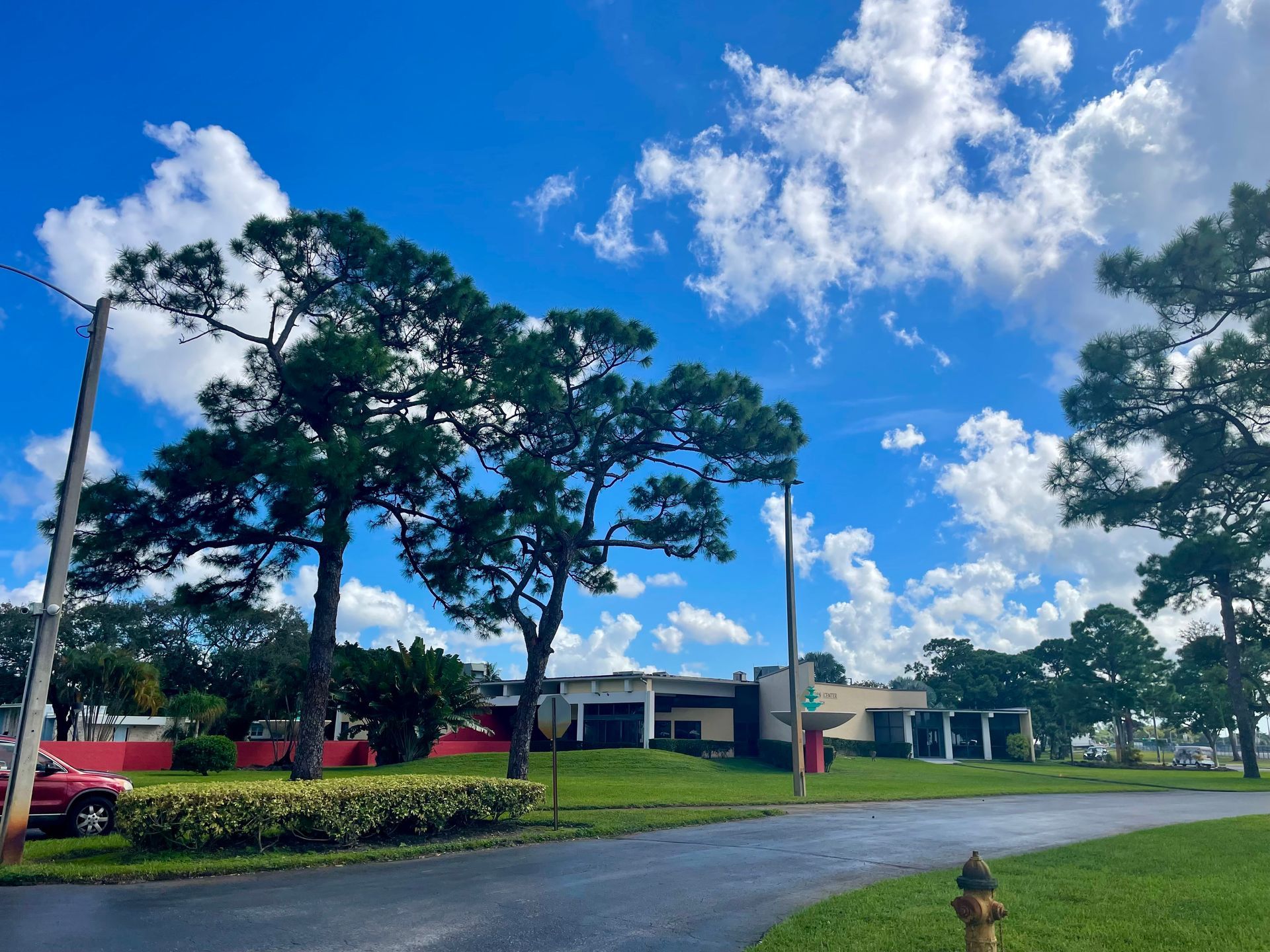 A stone building with a palm tree in front of it