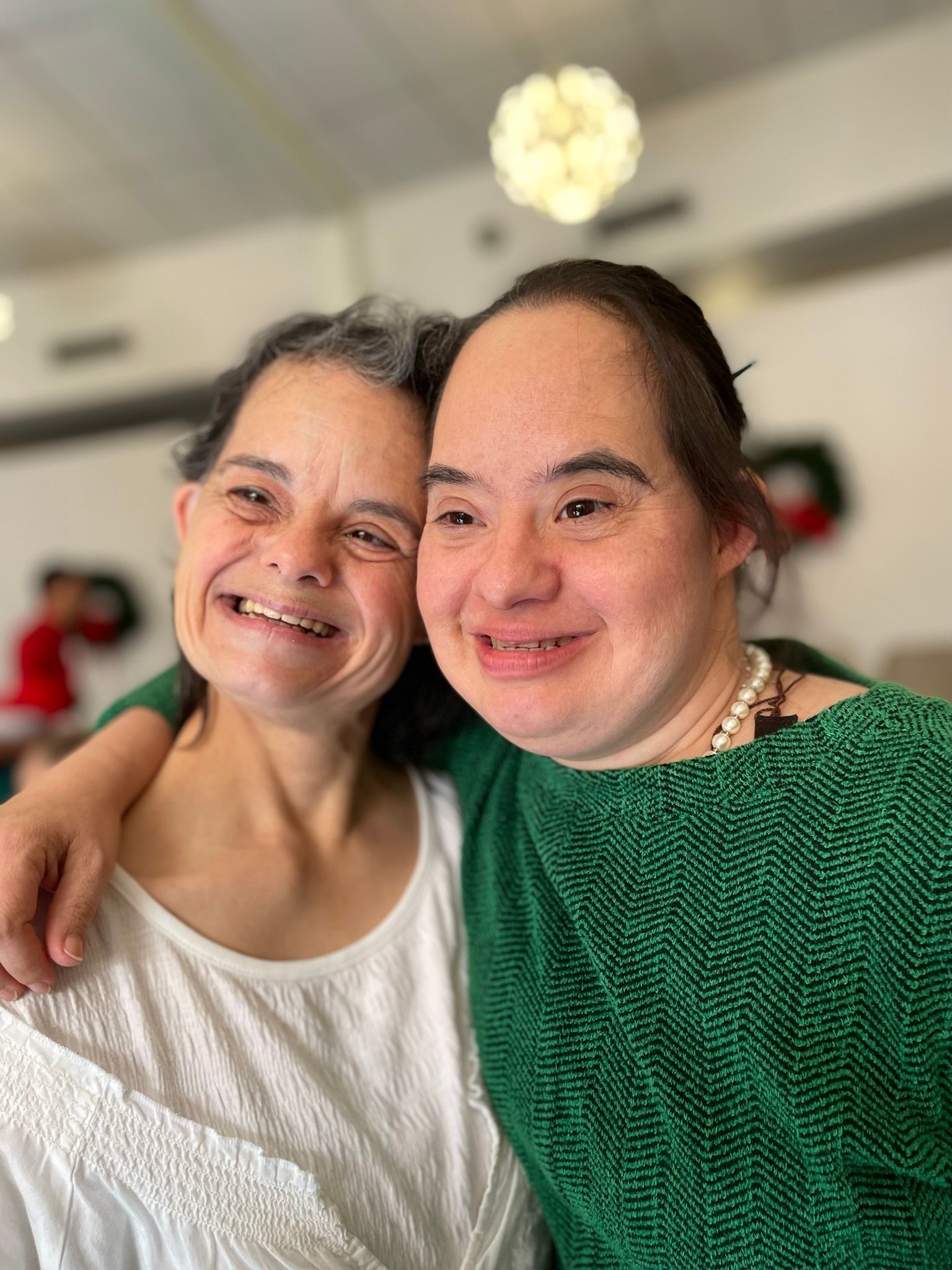 A group of people are holding carrots in their hands.