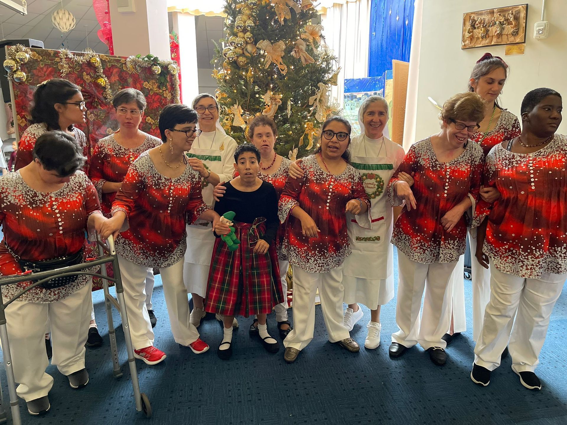 A red carpet is leading to the front door of a house.