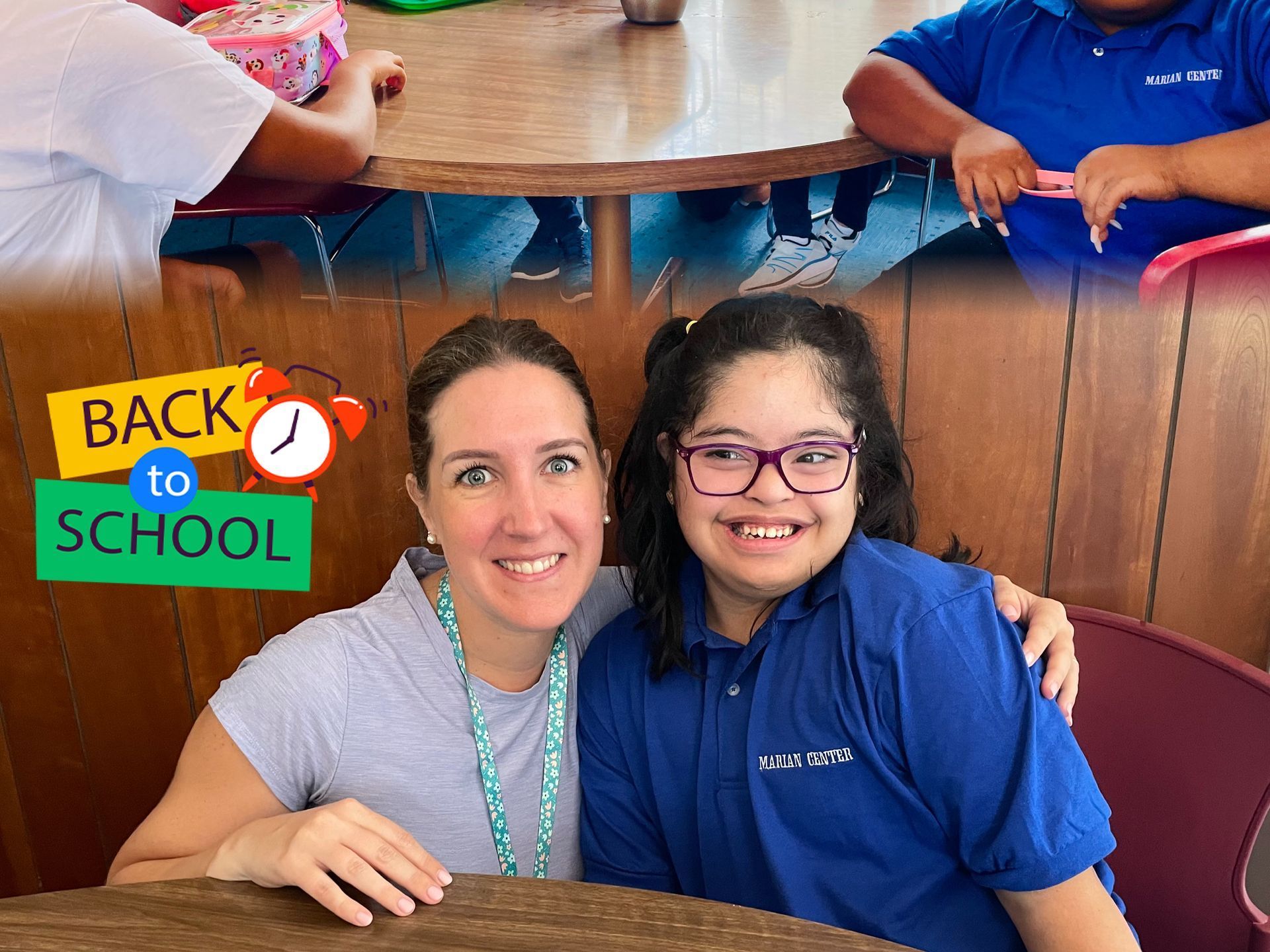 A group of people wearing face masks are playing in a classroom.