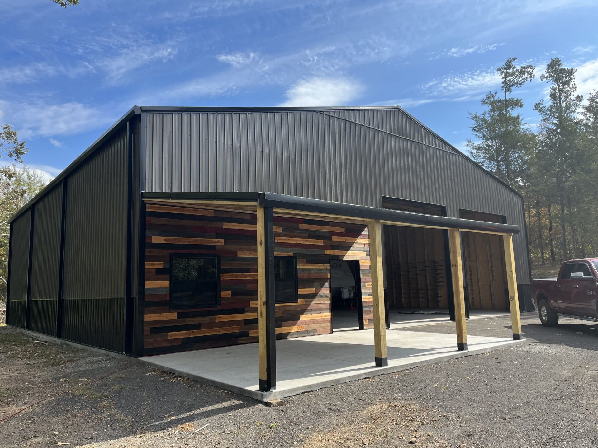 About Commercial Business Building Grey Metal Brown Wood 1st Choice Roofing & Contracting Builder Arkansas