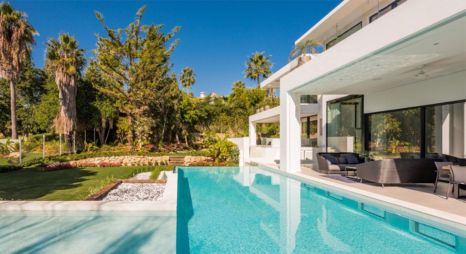interior design project in Villa Neuva Andalusia marbella spain image of outsude terrace with gescova sunbeds