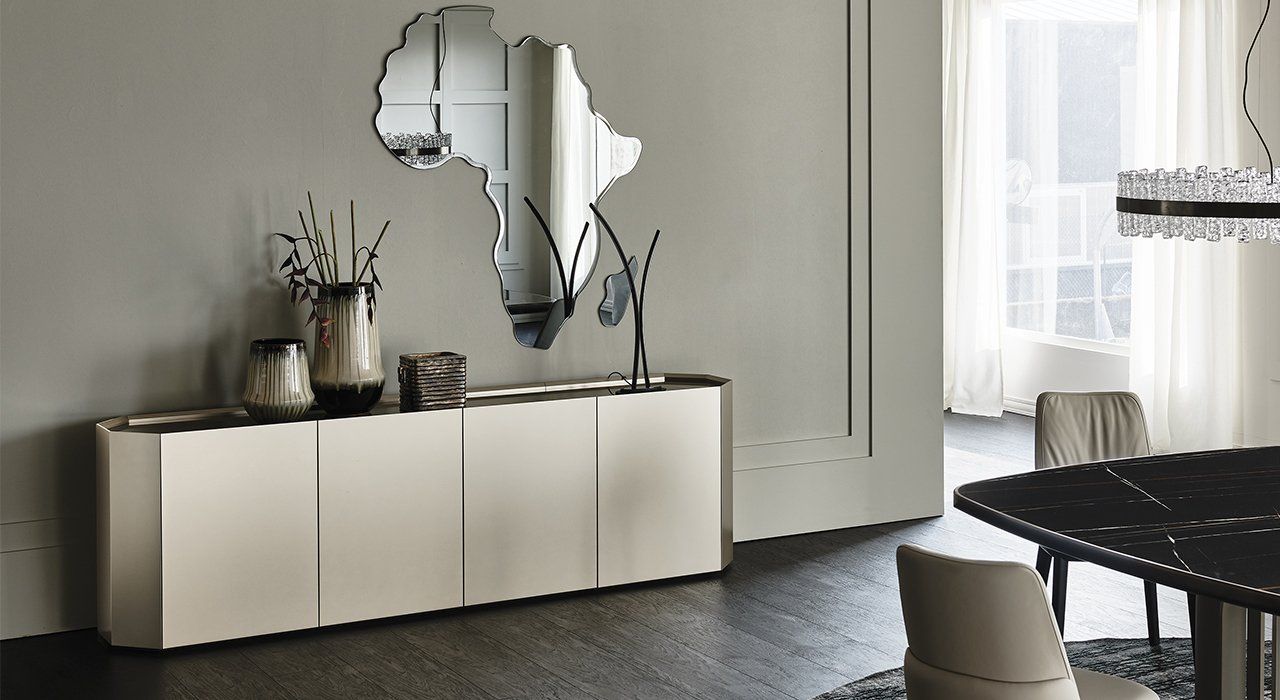 Cattelan Italia Chelsea Sideboard n Matt White Lacquered Wood with Titanium. Top in extra clear White painted glass or Bronze mirrored glass. Glass interior shelf. Base in 3 finish options in a contemporary living or dining space.