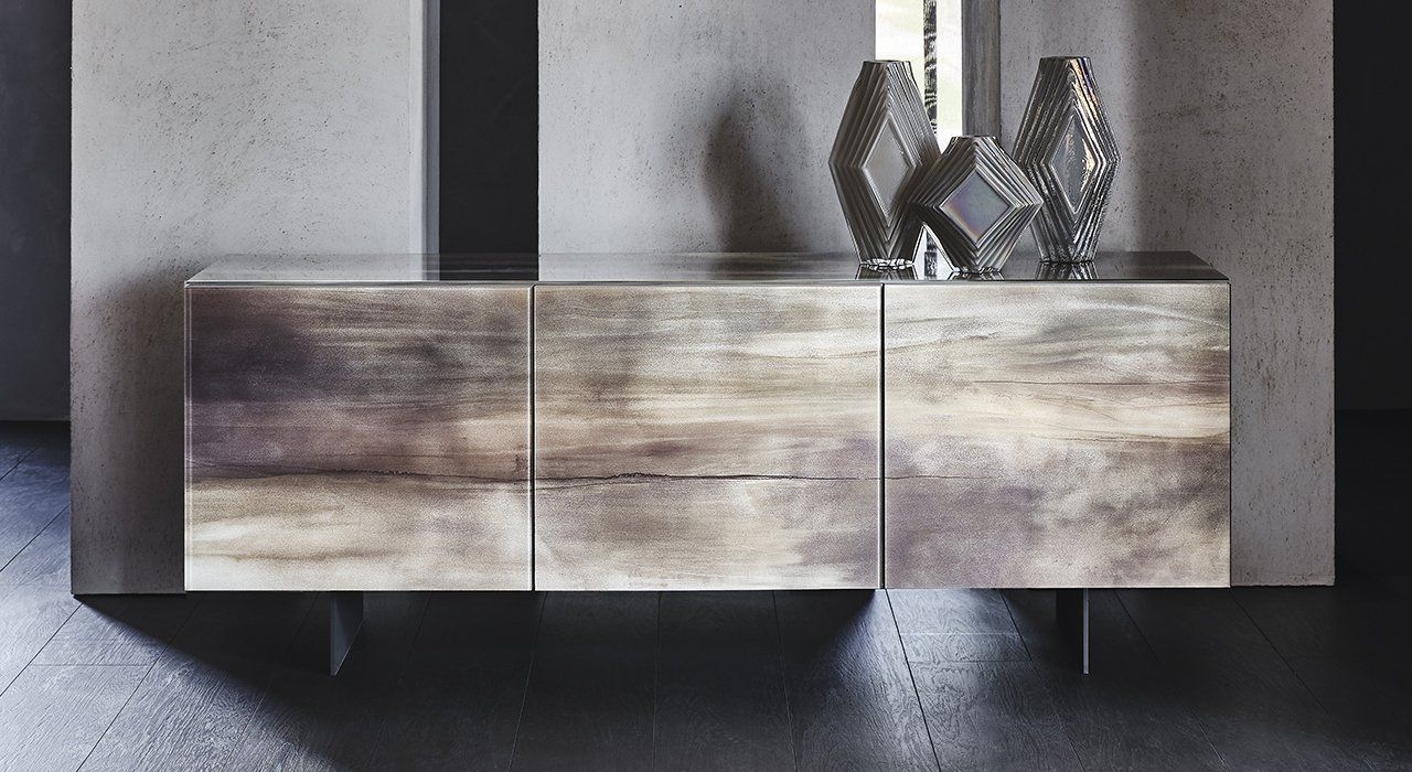 Cattelan Italia Focus Crystal Art sideboard in 3 lacquer finishes with painted stainless steel legs in a dining room. Made in Europe.