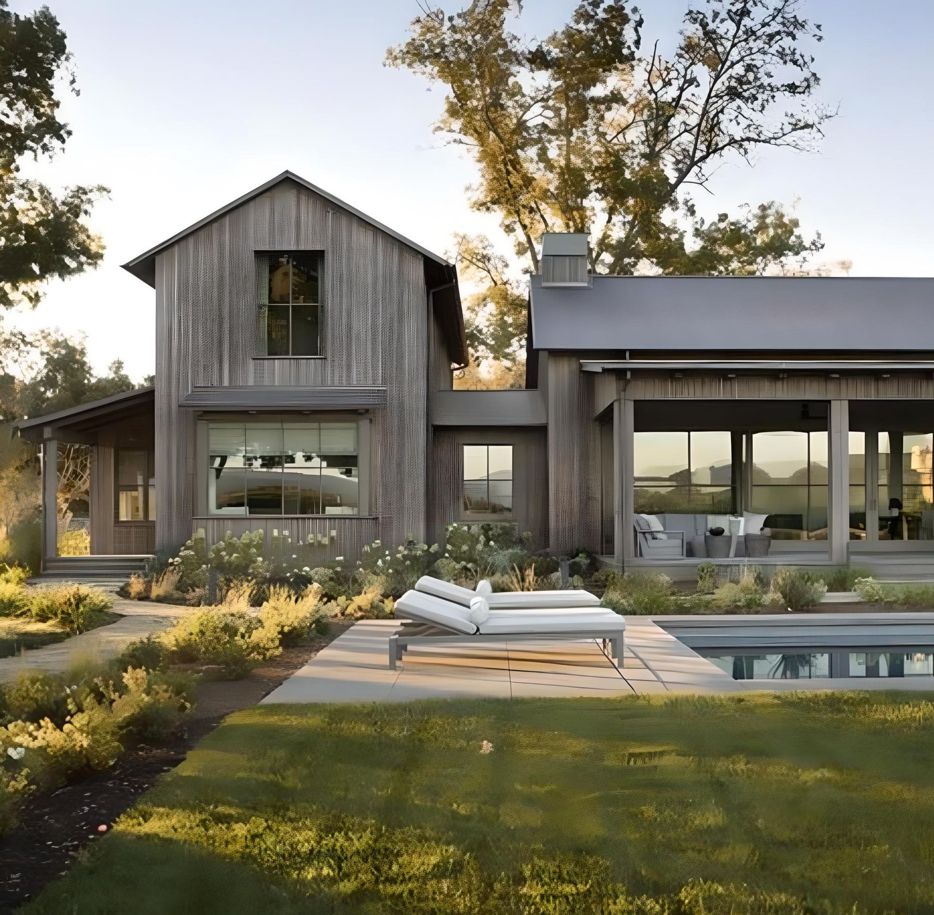 a house with a swimming pool in front of it