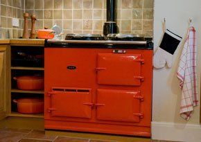 A red AGA cooker in a kitchen