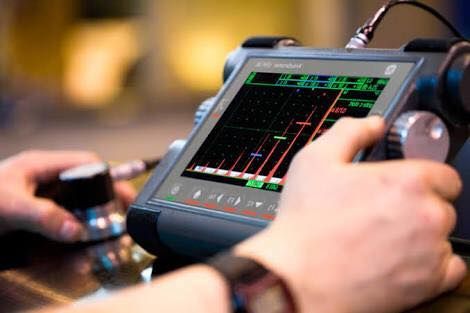 A Close Up Of A Person Using A Tablet Computer — LJ's Technical Services In Burdell, QLD