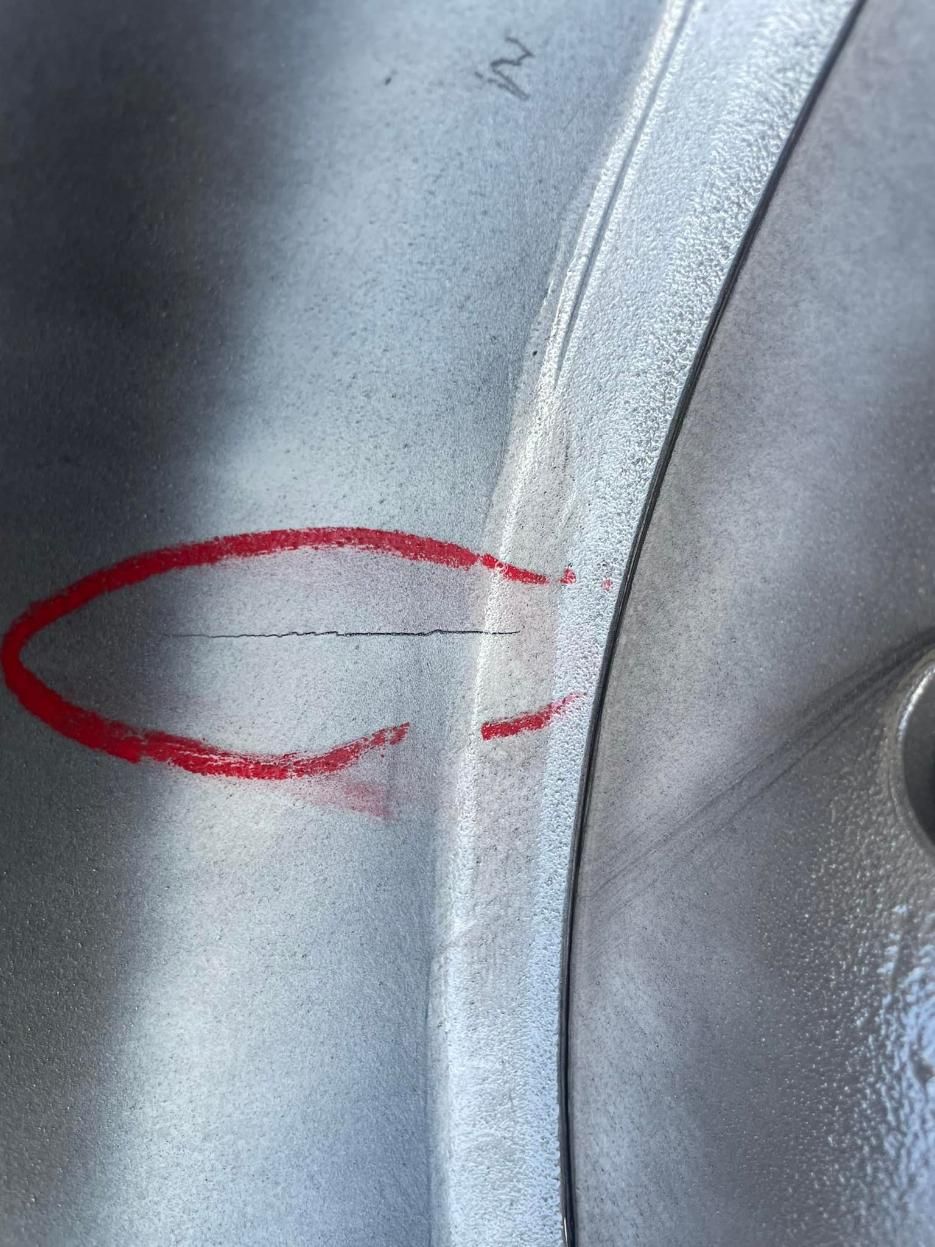 A Close Up Of A Metal Surface With A Red Circle Drawn On It — LJ's Technical Services In Mackay, QLD