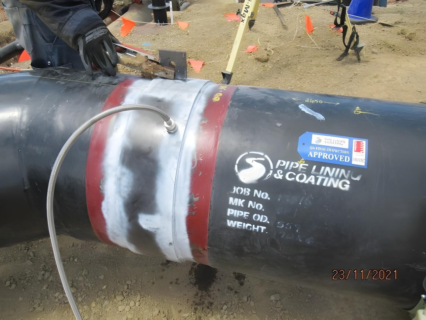 A Person Is Working On A Pipe — LJ's Technical Services In Mount Isa, QLD