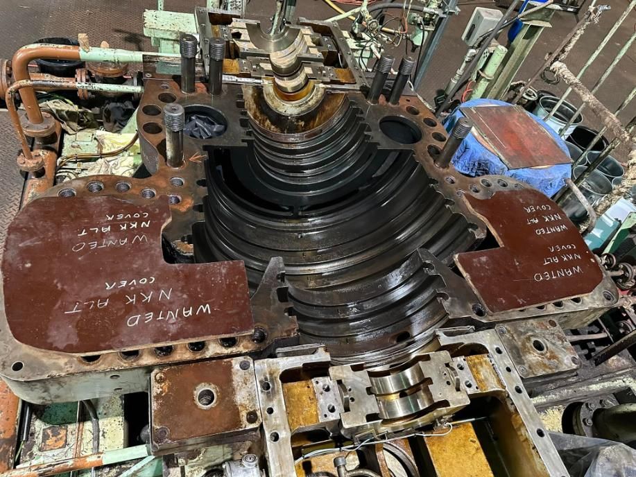 A Bunch Of Metal Parts Are Sitting On Top Of Each Other On A Table — LJ's Technical Services In Burdell, QLD