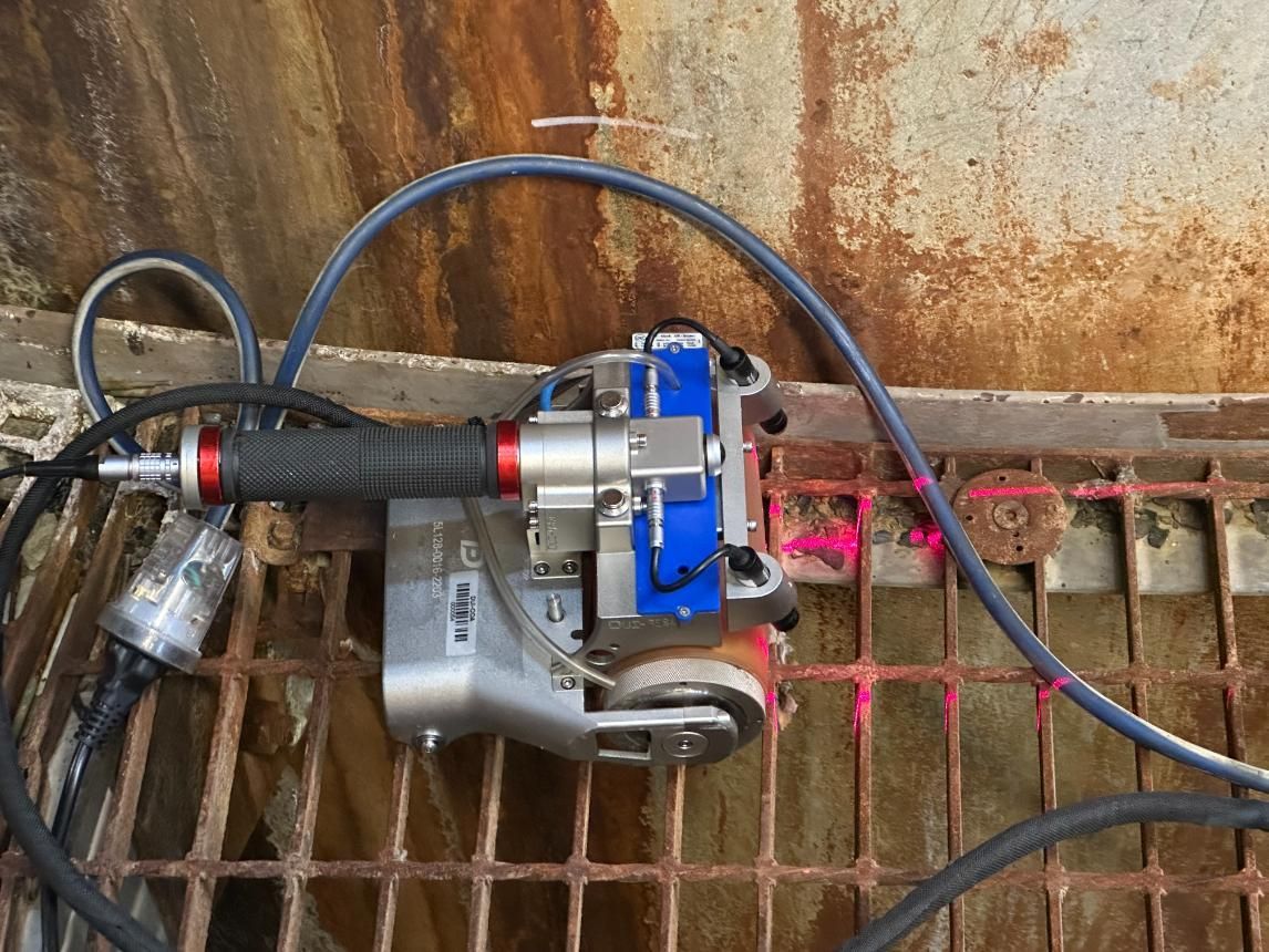 Magnetic Scanner On A Rusted Surface With Red Laser Lines — LJ's Technical Services In Burdell, QLD