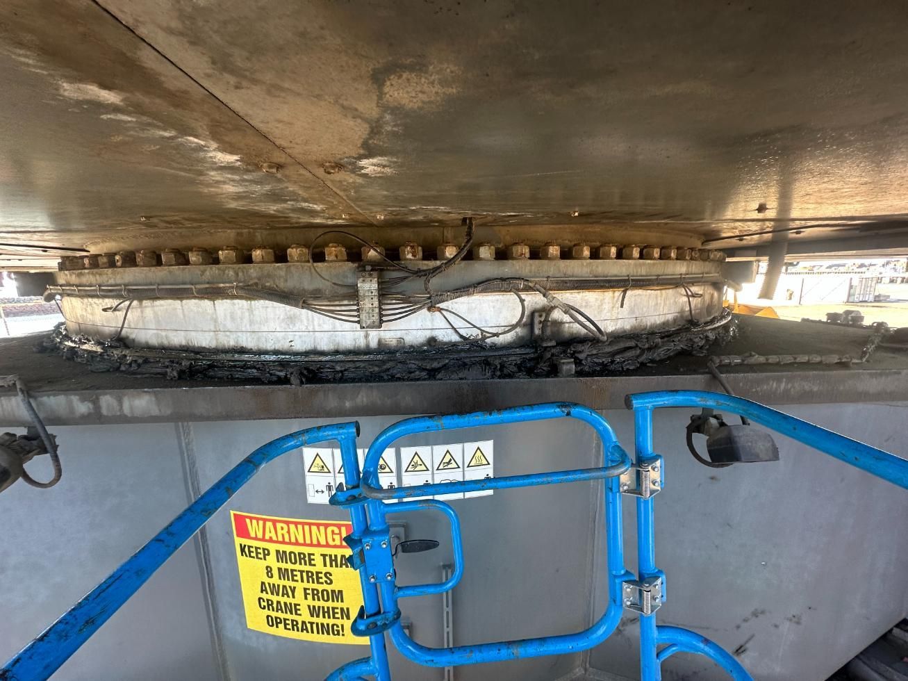 A Warning Sign Is On The Side Of A Metal Structure — LJ's Technical Services In Burdell, QLD