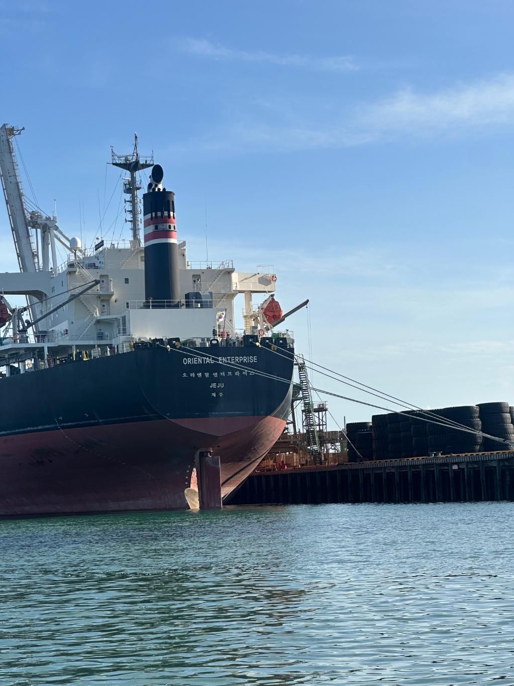 A Large Cargo Ship Is Docked In A Harbor β LJ's Technical Services In Burdell, QLD