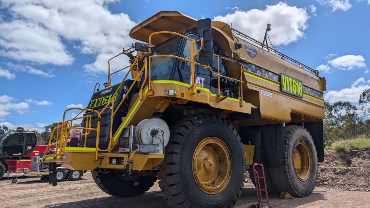 A Large Yellow Dump Truck Is Parked In A Dirt Field β LJ's Technical Services In Burdell, QLD