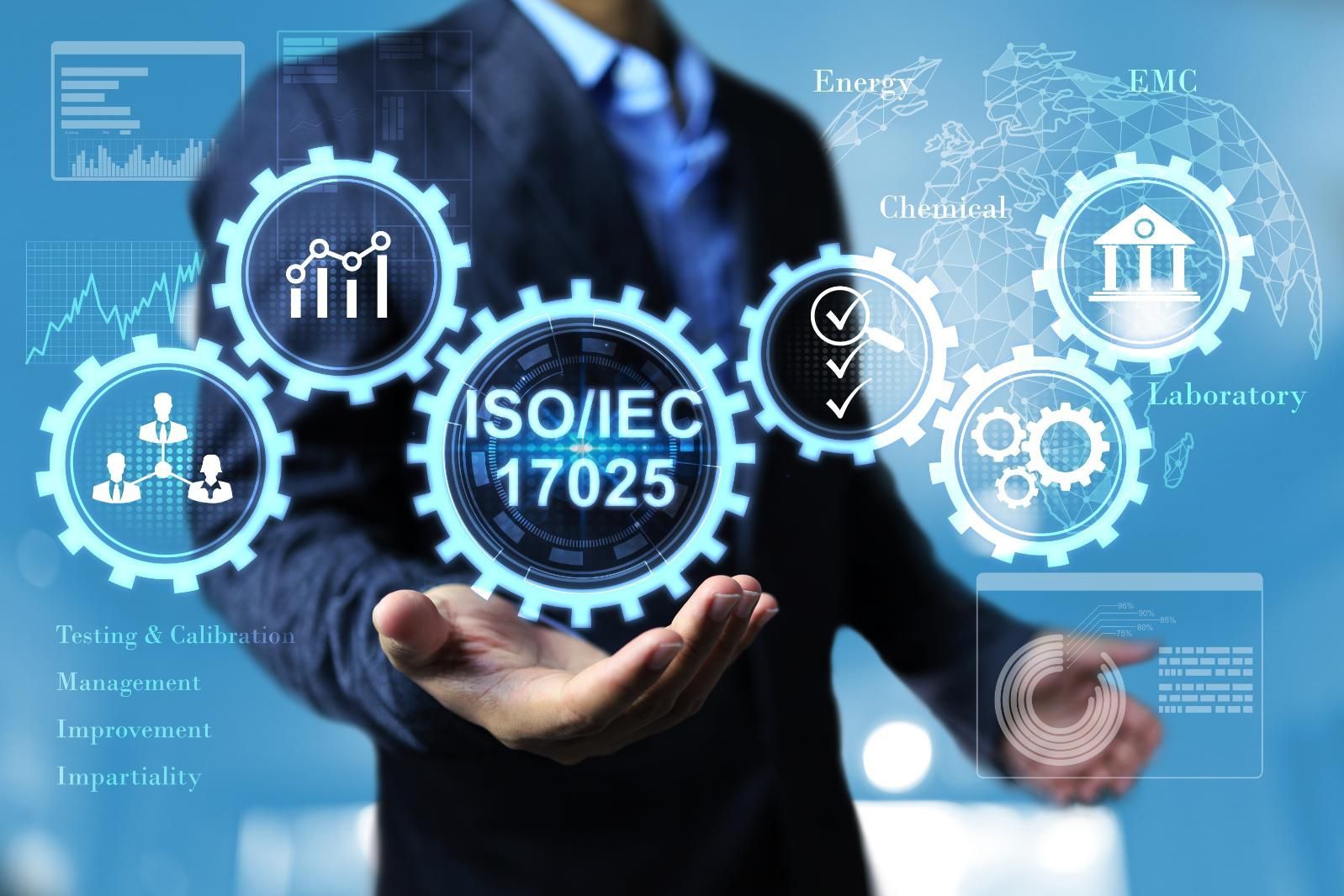 A Man In A Suit Is Holding A Virtual Screen With Iso / Iec 17025 Written On It — LJ's Technical Services In Burdell, QLD