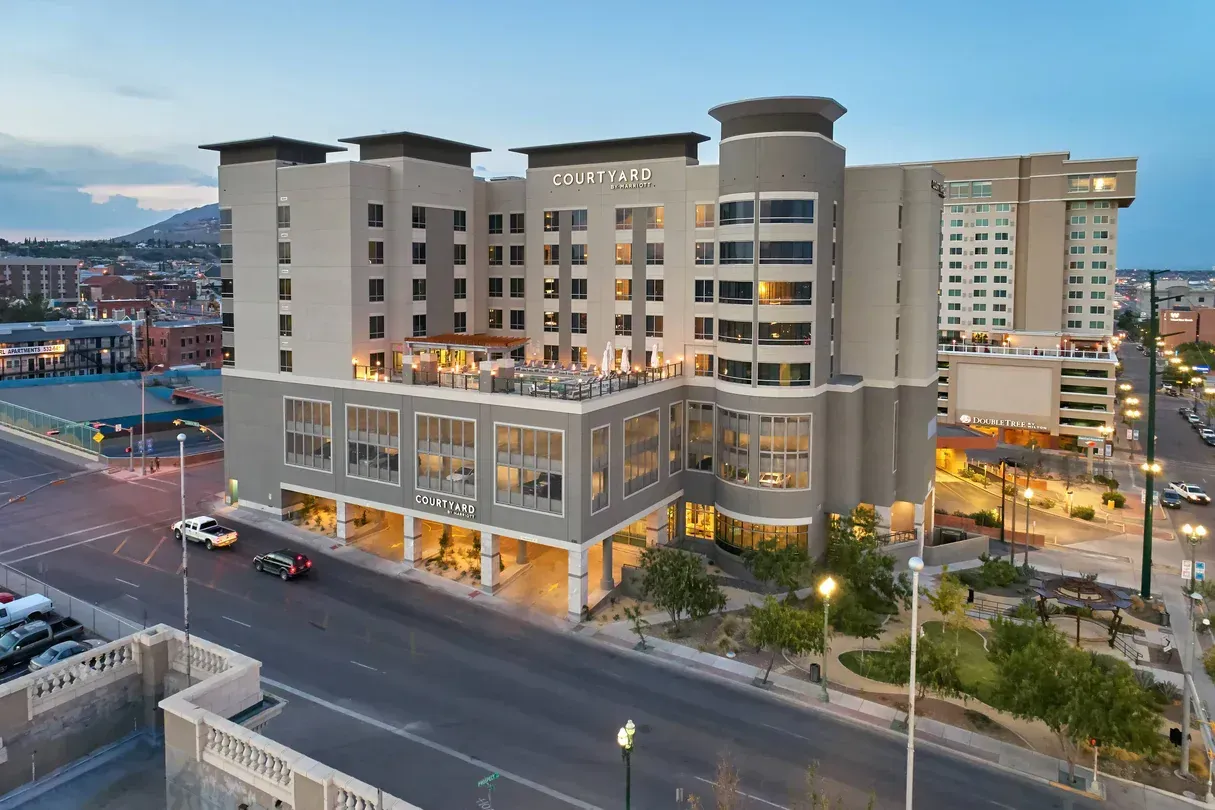 Hotel Paso del Norte, El Paso, Texas. Exterior shot of a multi-story building with a light-colored facade, at dusk.