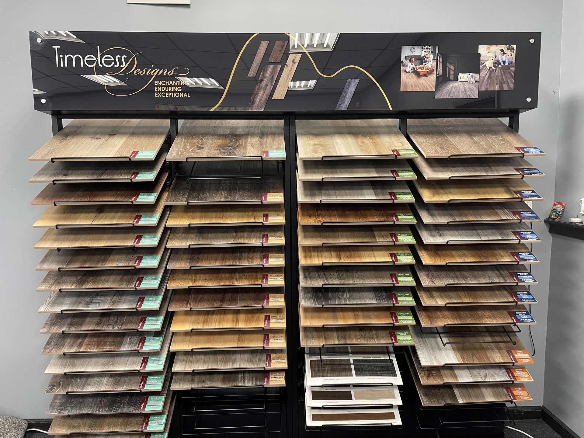 A display of different types of hardwood flooring in a store.
