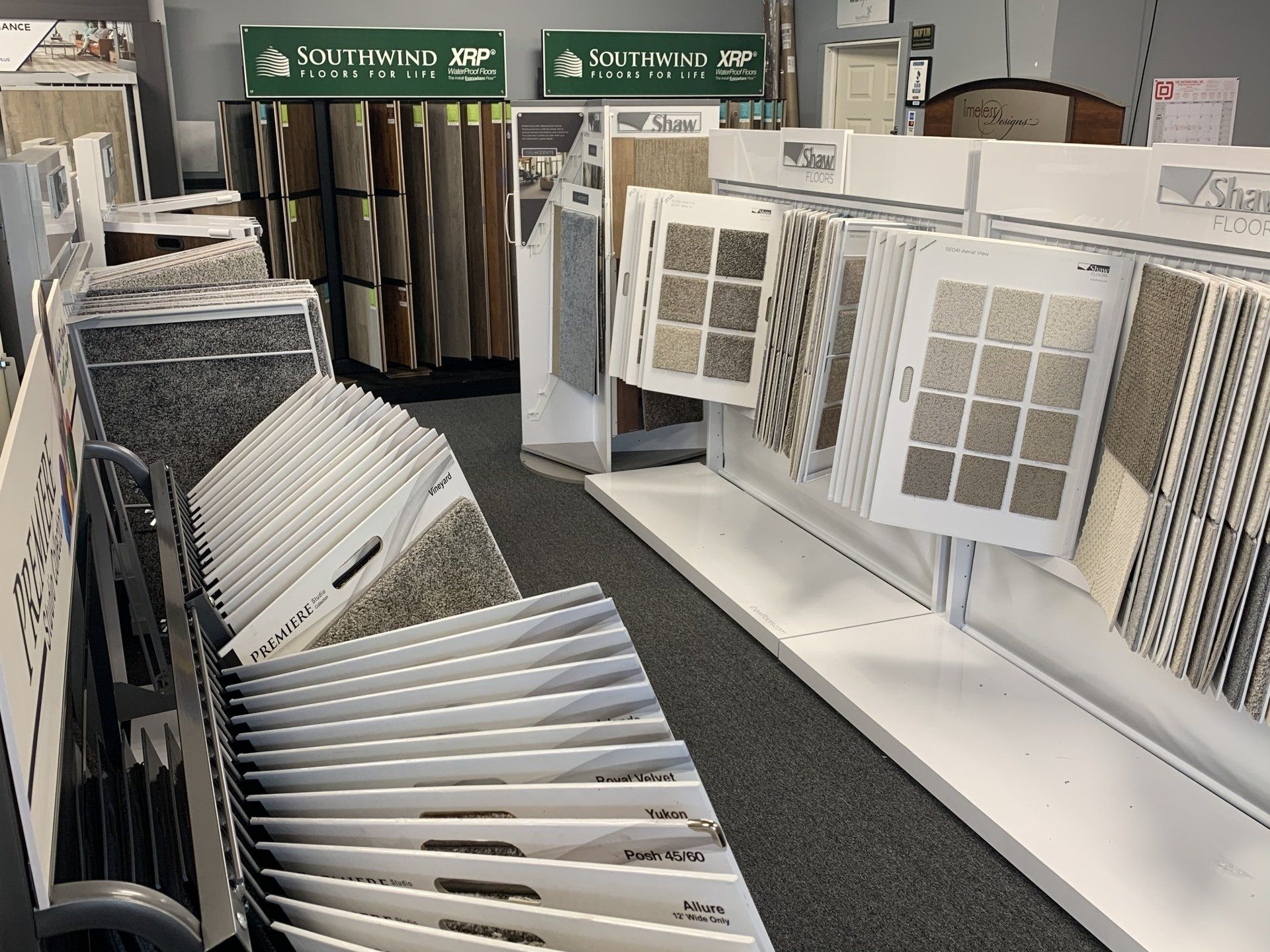 A store filled with lots of carpets and tiles.