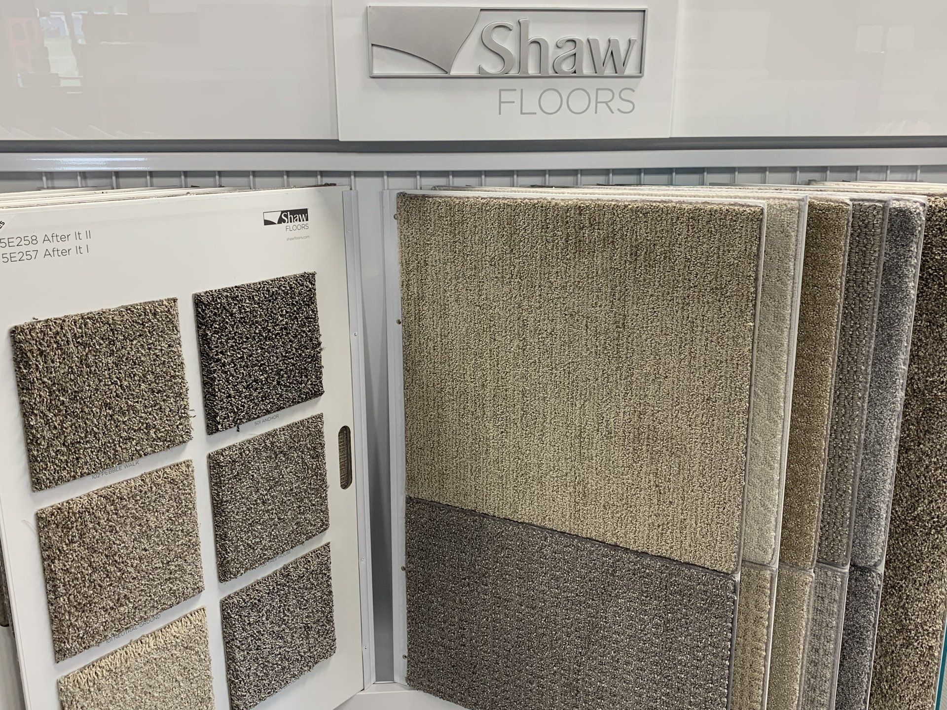 A display of shaw floors carpets in a store.