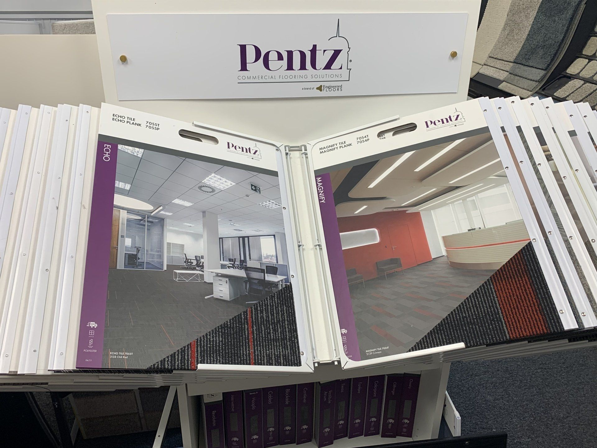 A stack of carpet samples sitting on top of a table.