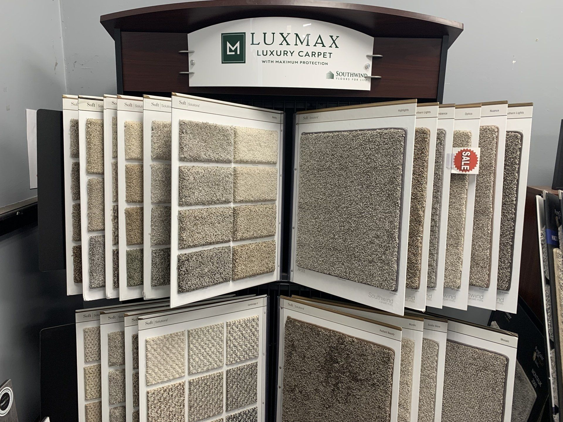 A display of carpets and tiles in a store.