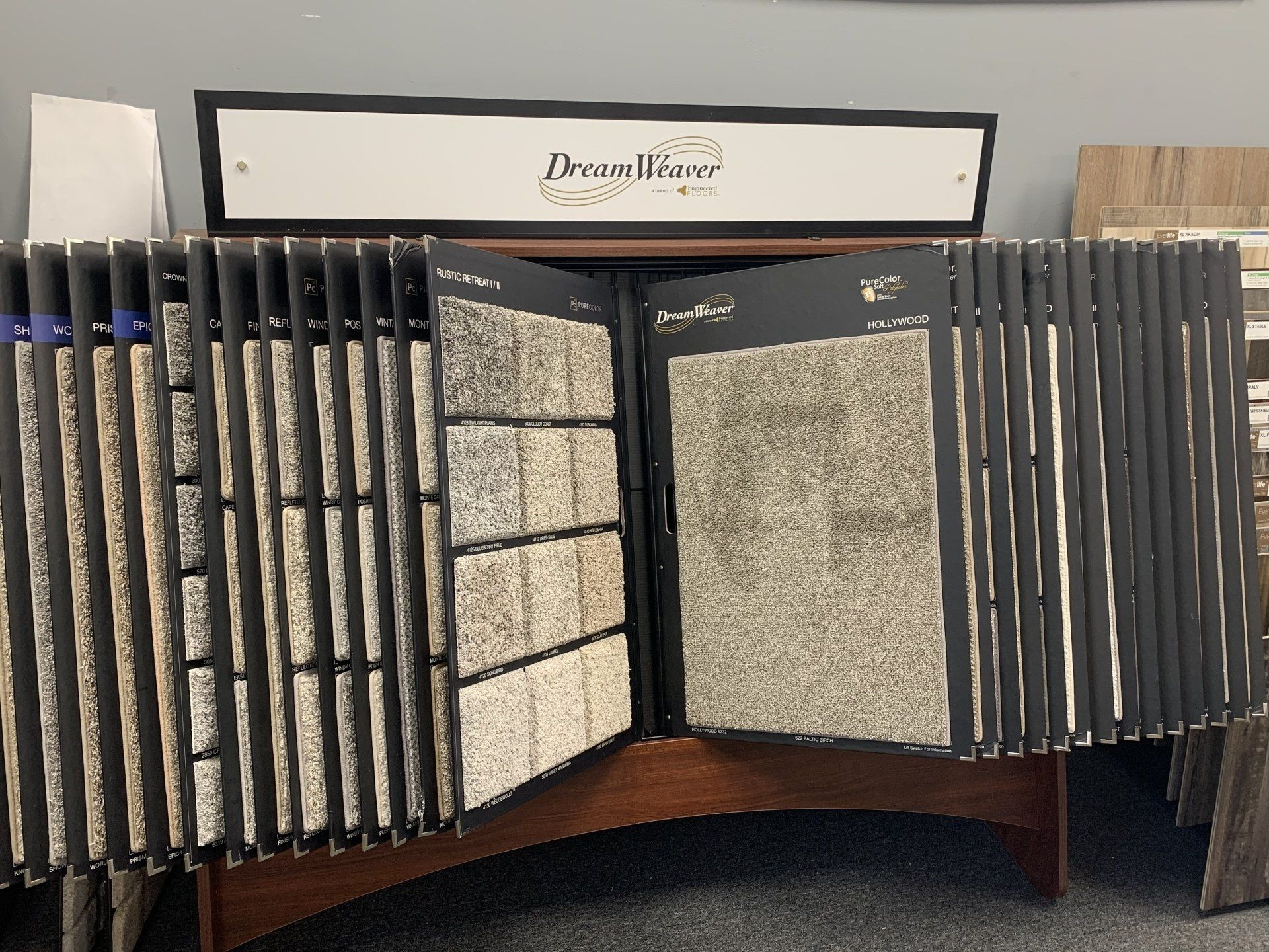 A display of carpets with a sign that says dream floor