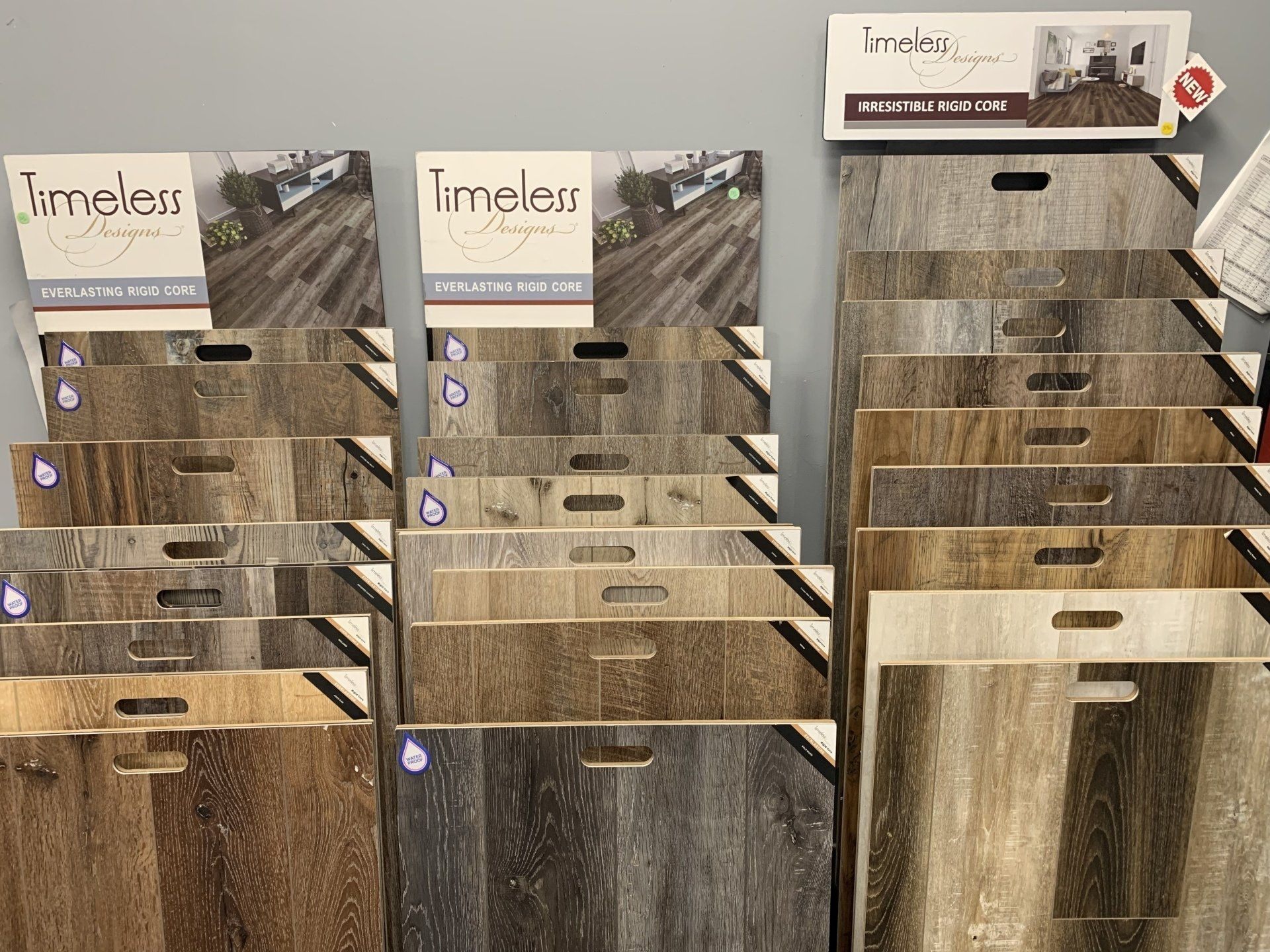 A display of different types of wood flooring in a store.